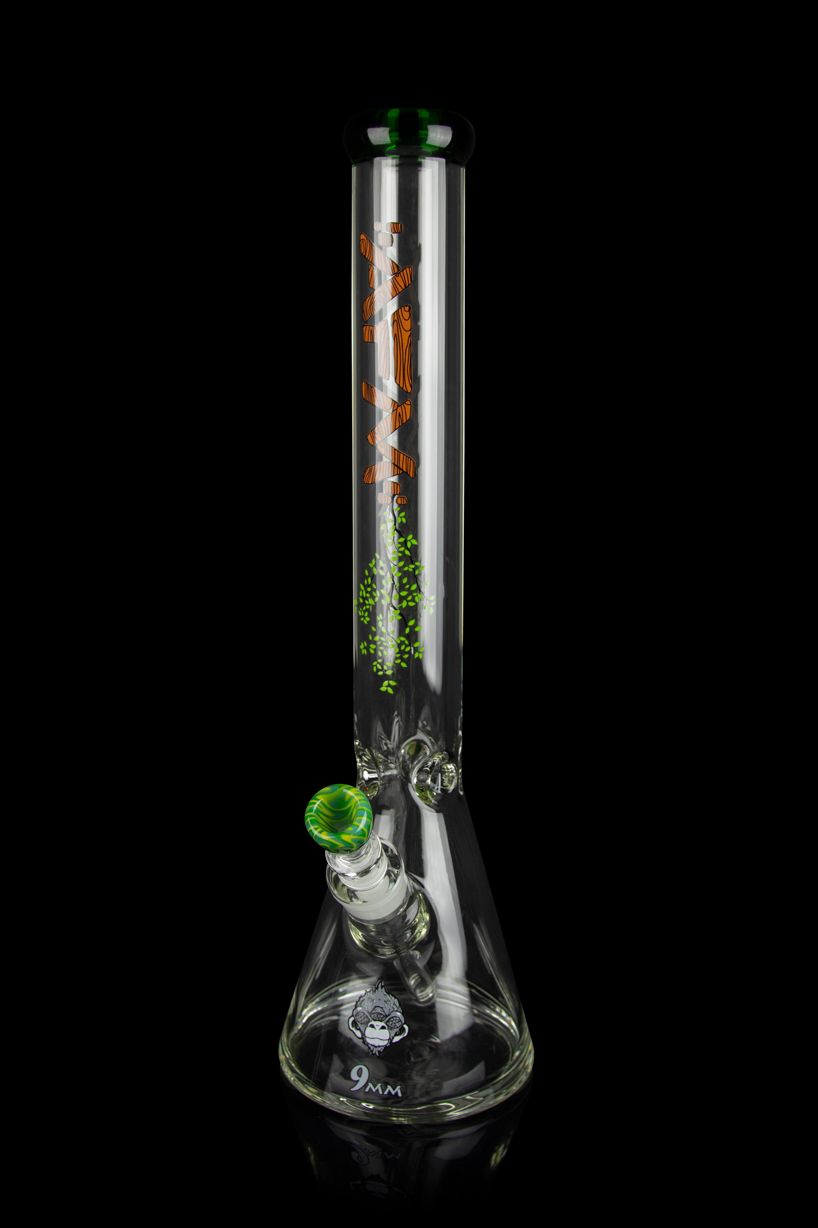 Glass bong with colorful graphics and a green mouthpiece, isolated on a black background.