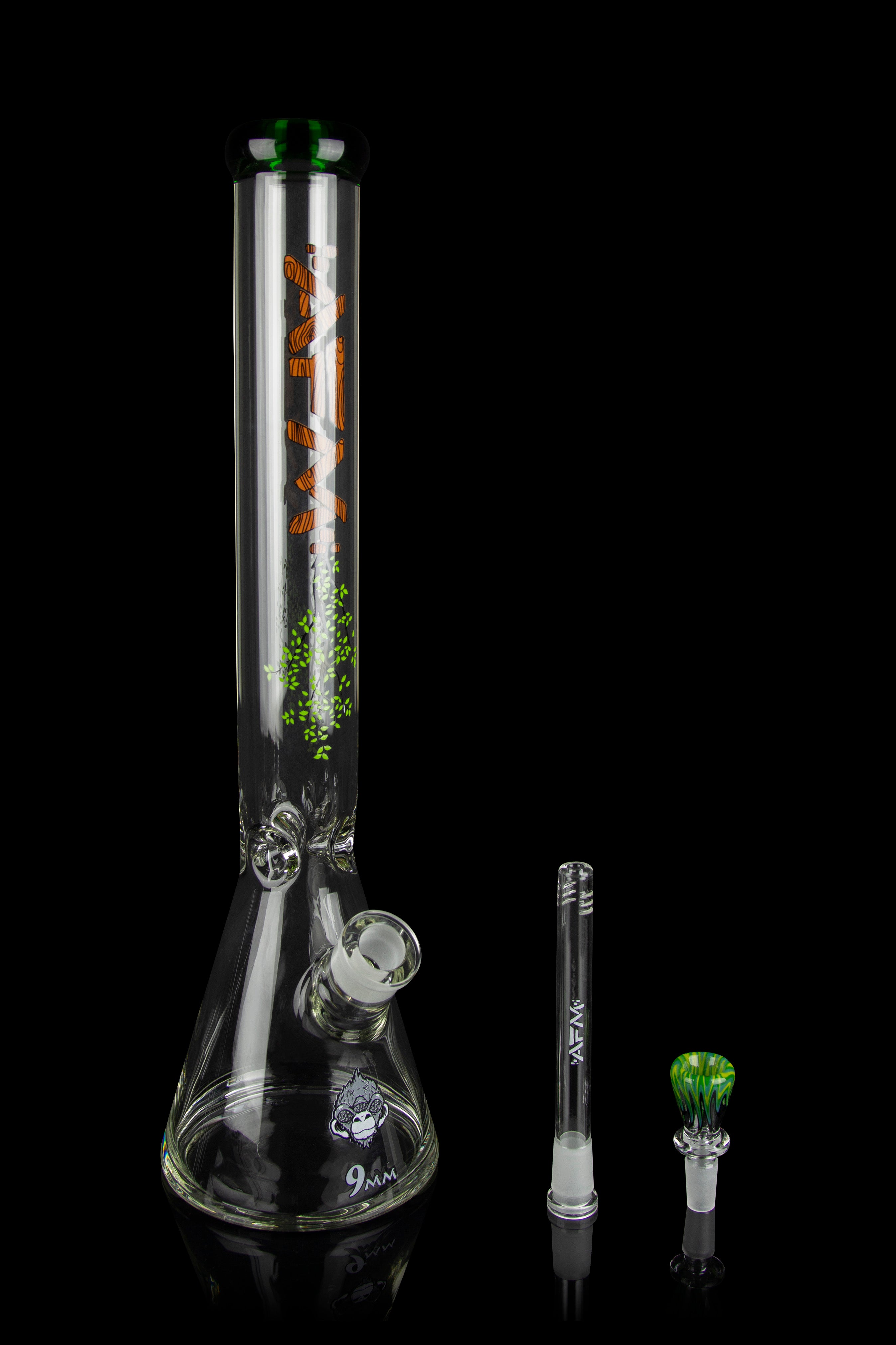 Glass bong with orange and green leaf designs, displayed with a downstem and bowl.