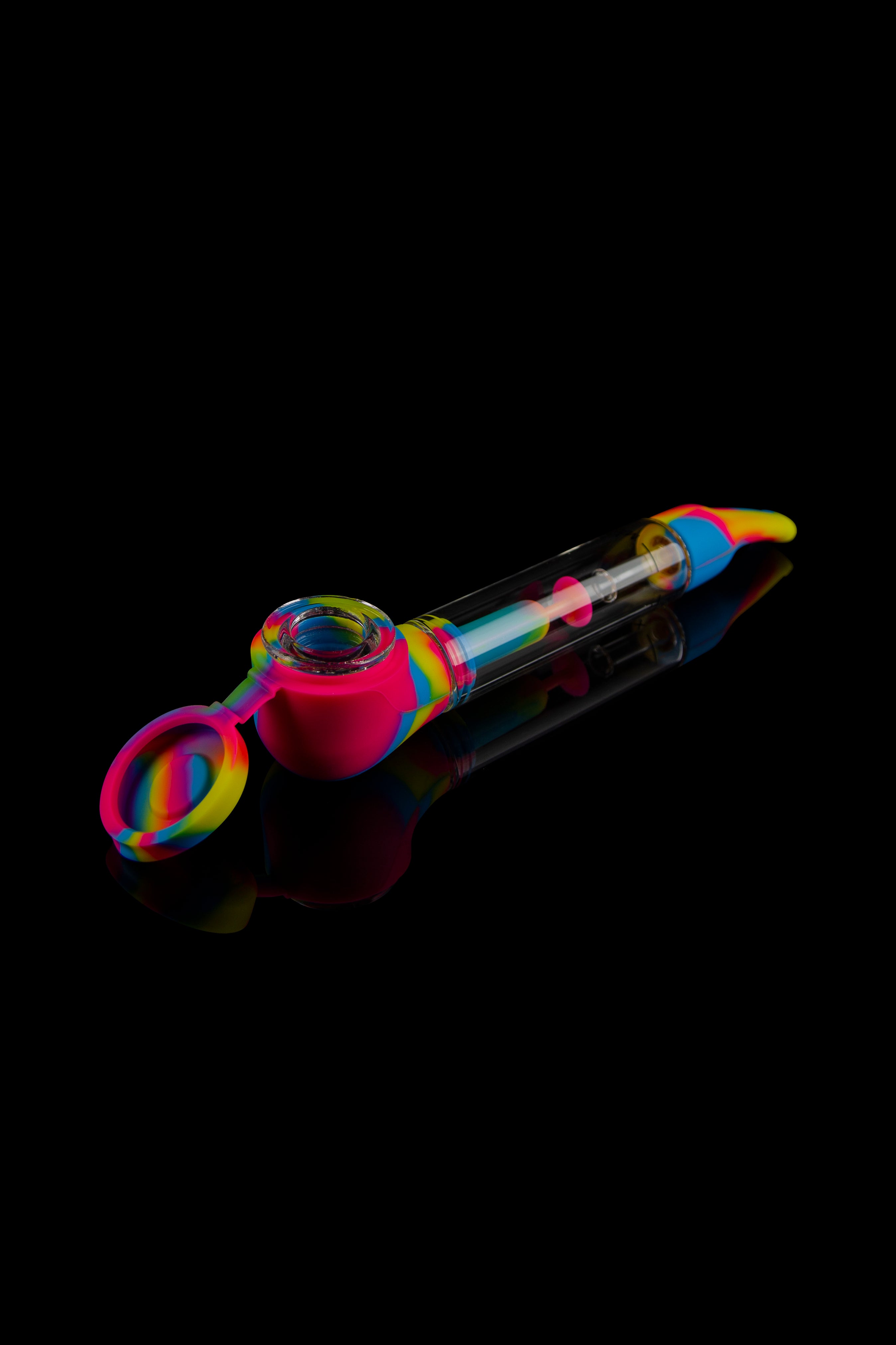 Colorful silicone glass pipe with a clear chamber, isolated on a black background.
