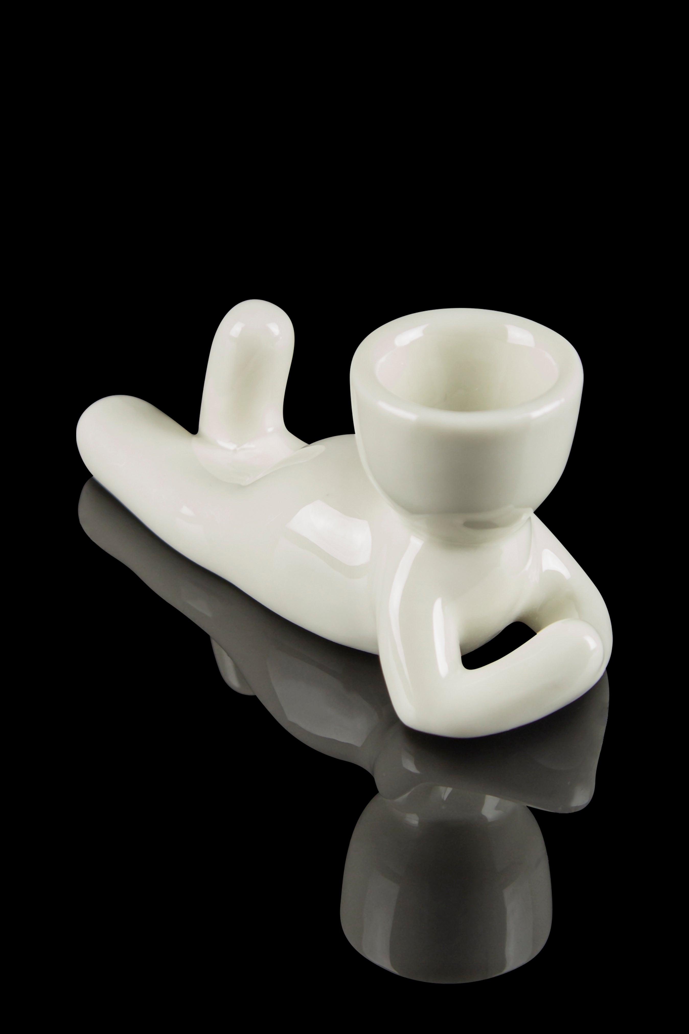 White glass chillum with a catch basin, studio shot on a reflective surface.