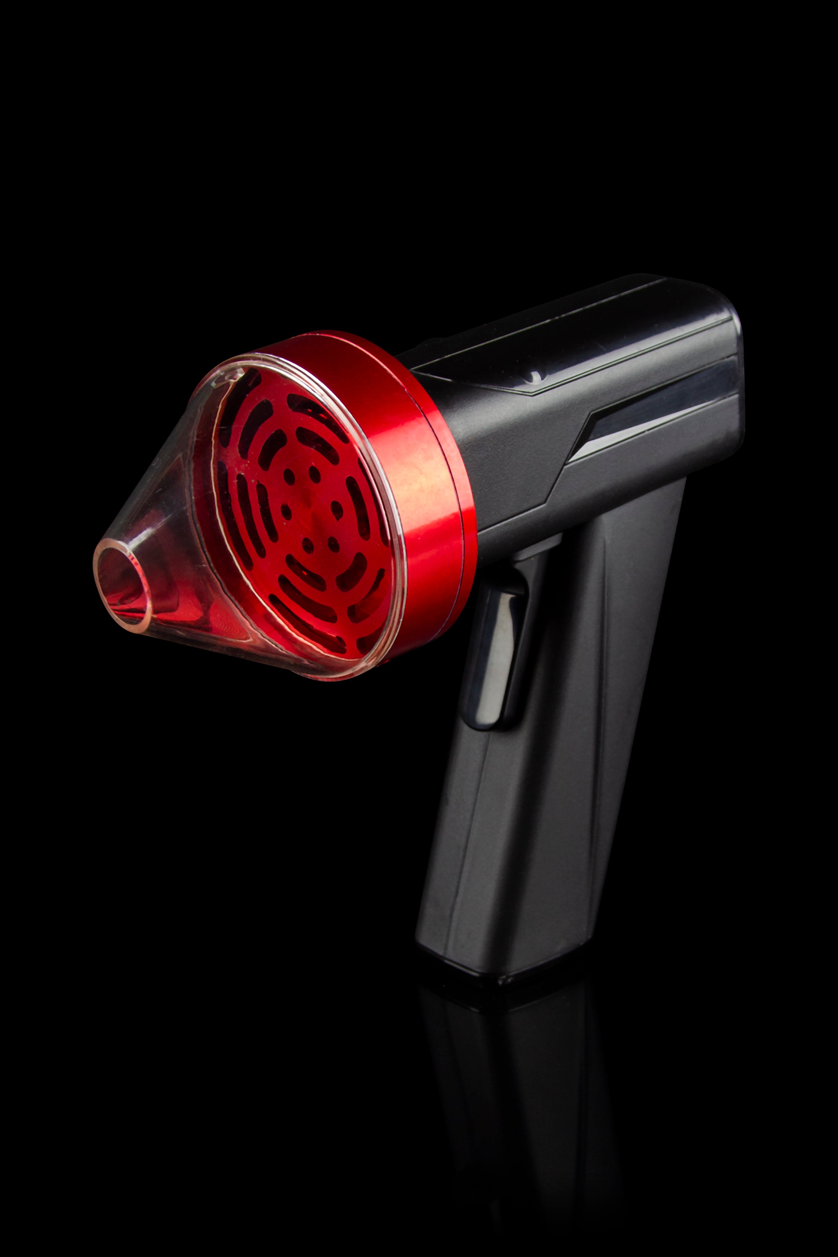 Red and black handheld cannabis oil vaporizer on black background.