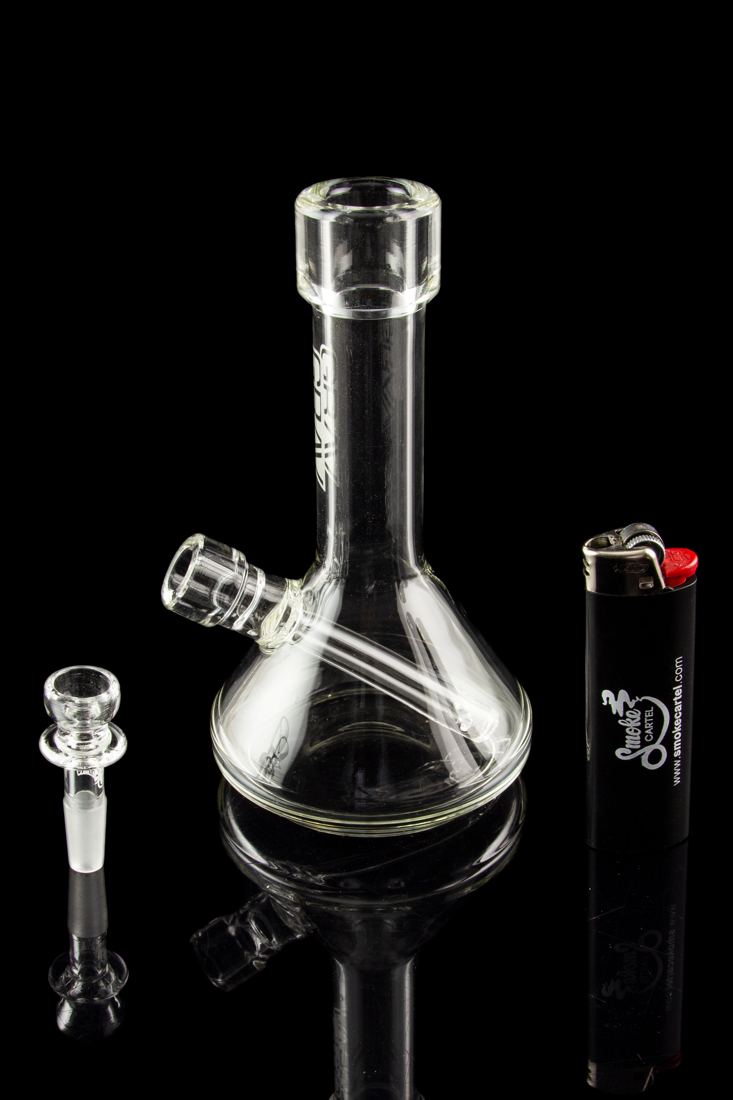 Clear glass bong with a detachable downstem and bowl, alongside a lighter, against a black background.