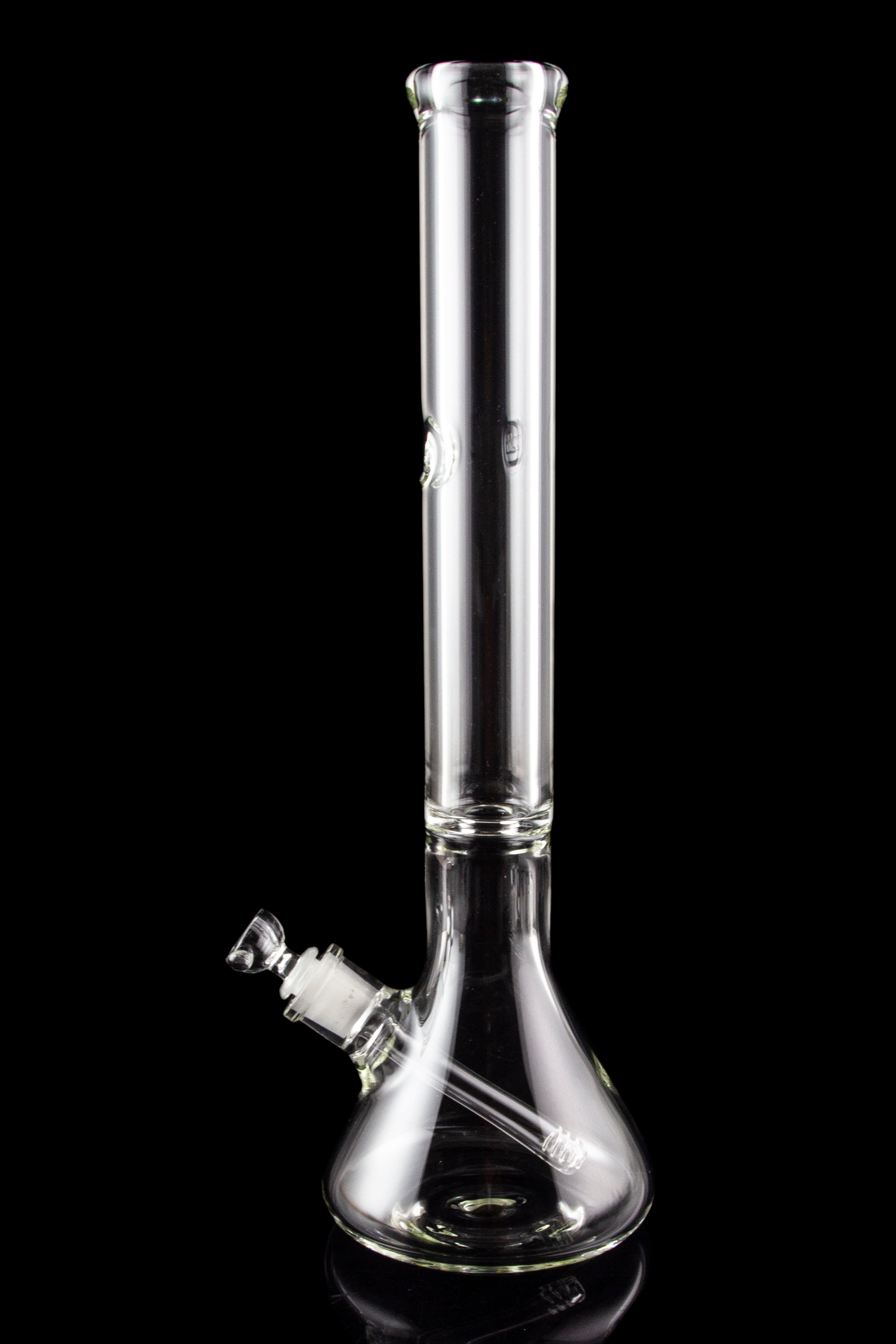 Clear glass bong with ice catch and downstem, isolated on black.