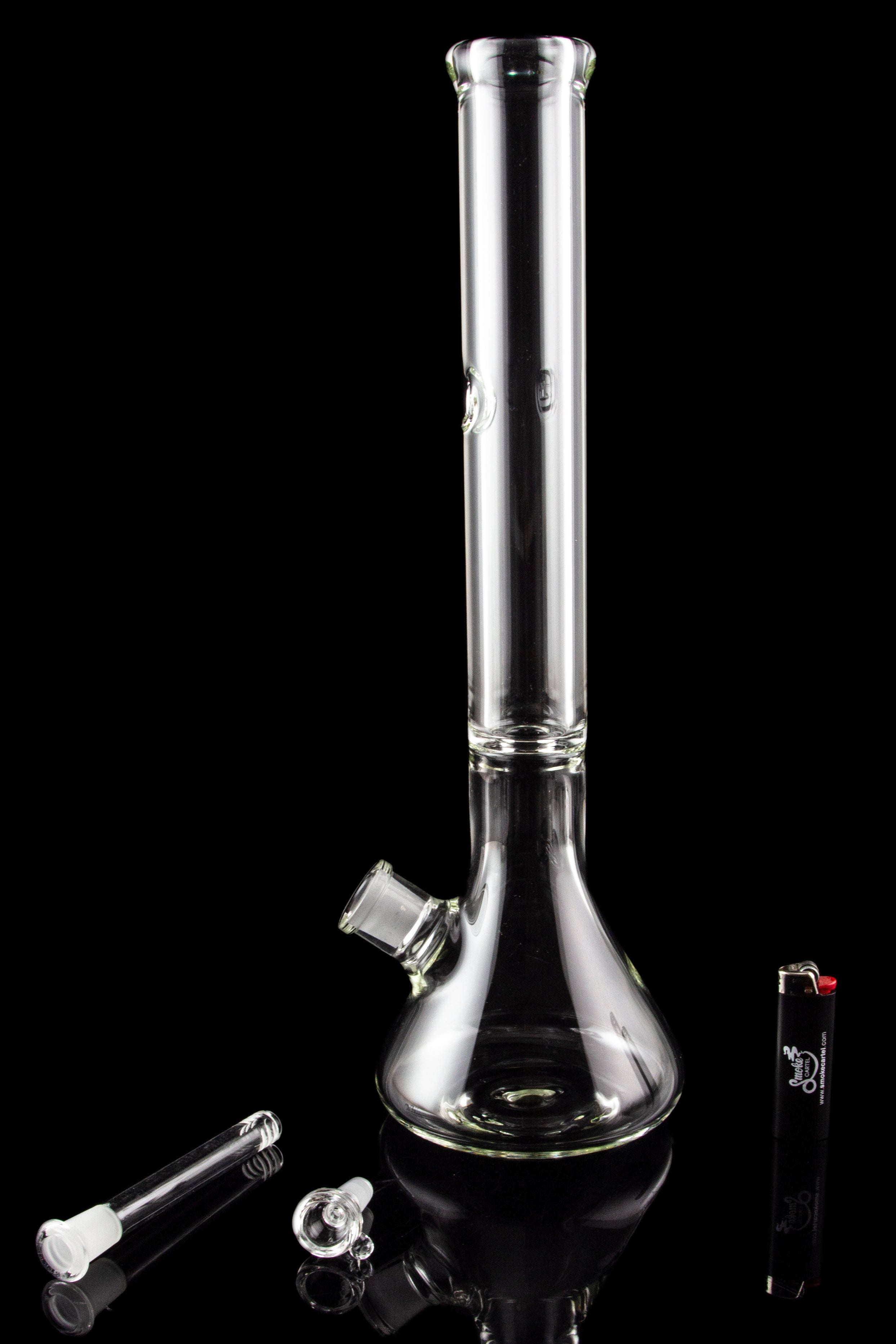 Clear glass bong with attachments on a black background.