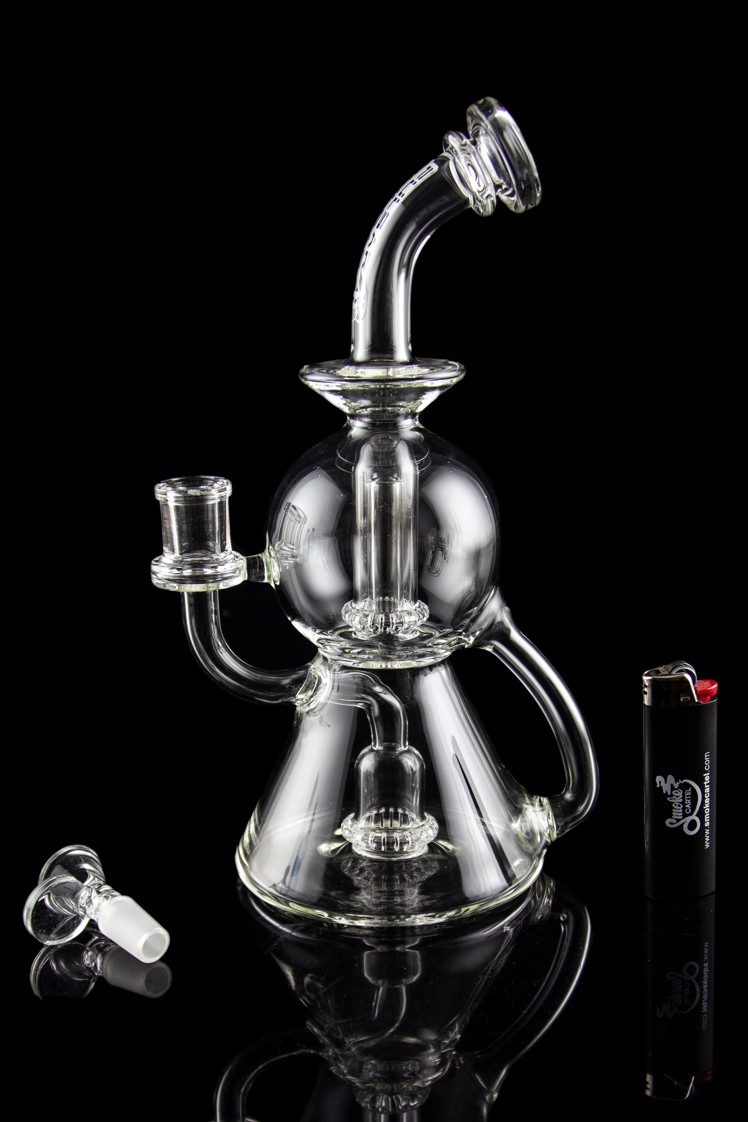 Clear glass water pipe (bong) with multiple chambers and a glass bowl, displayed on a black background.