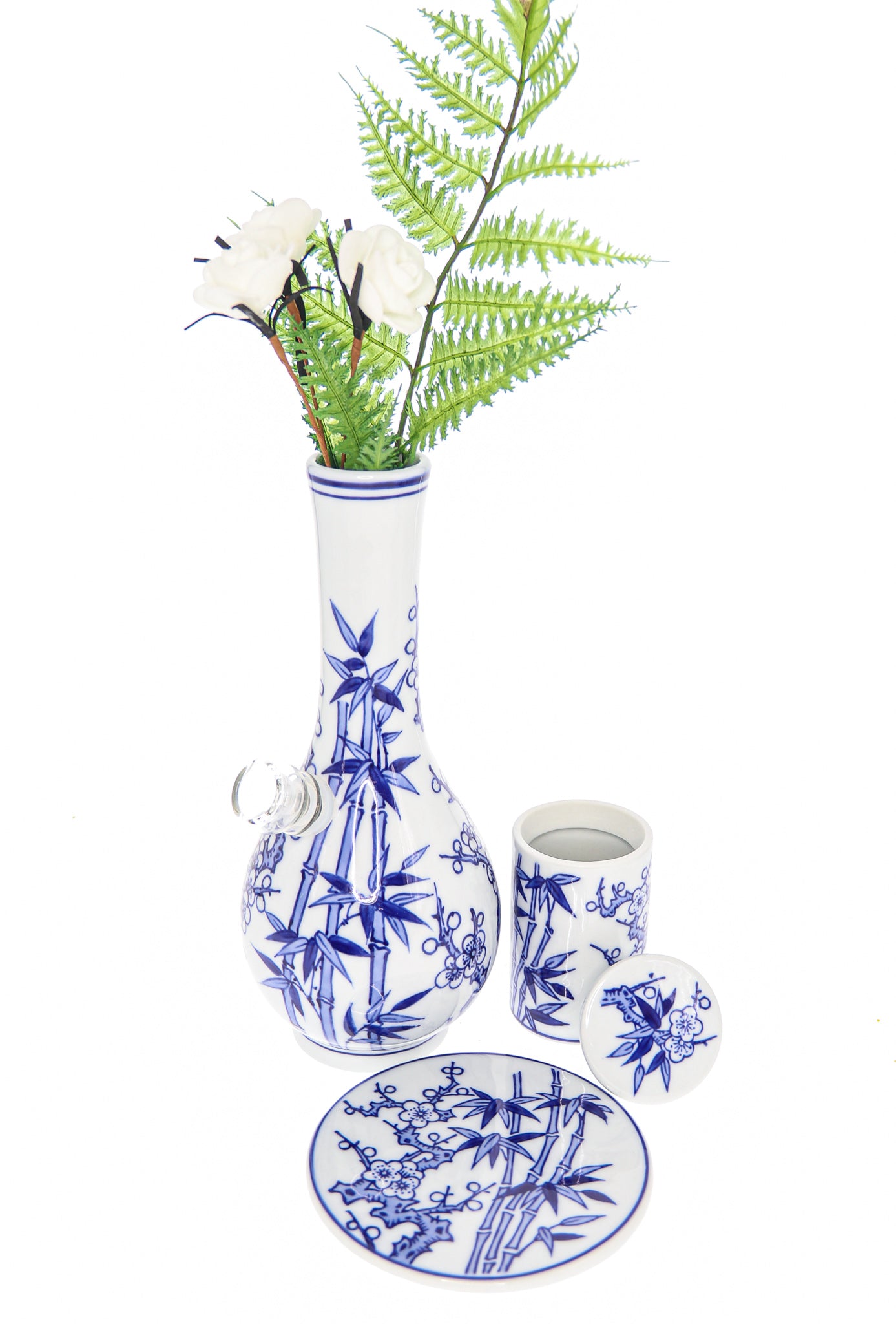 A front view of the “My Bud Vase “Luck” Porcelain Vase Bong”, displaying a white porcelain vase with delicate blue floral detailing.