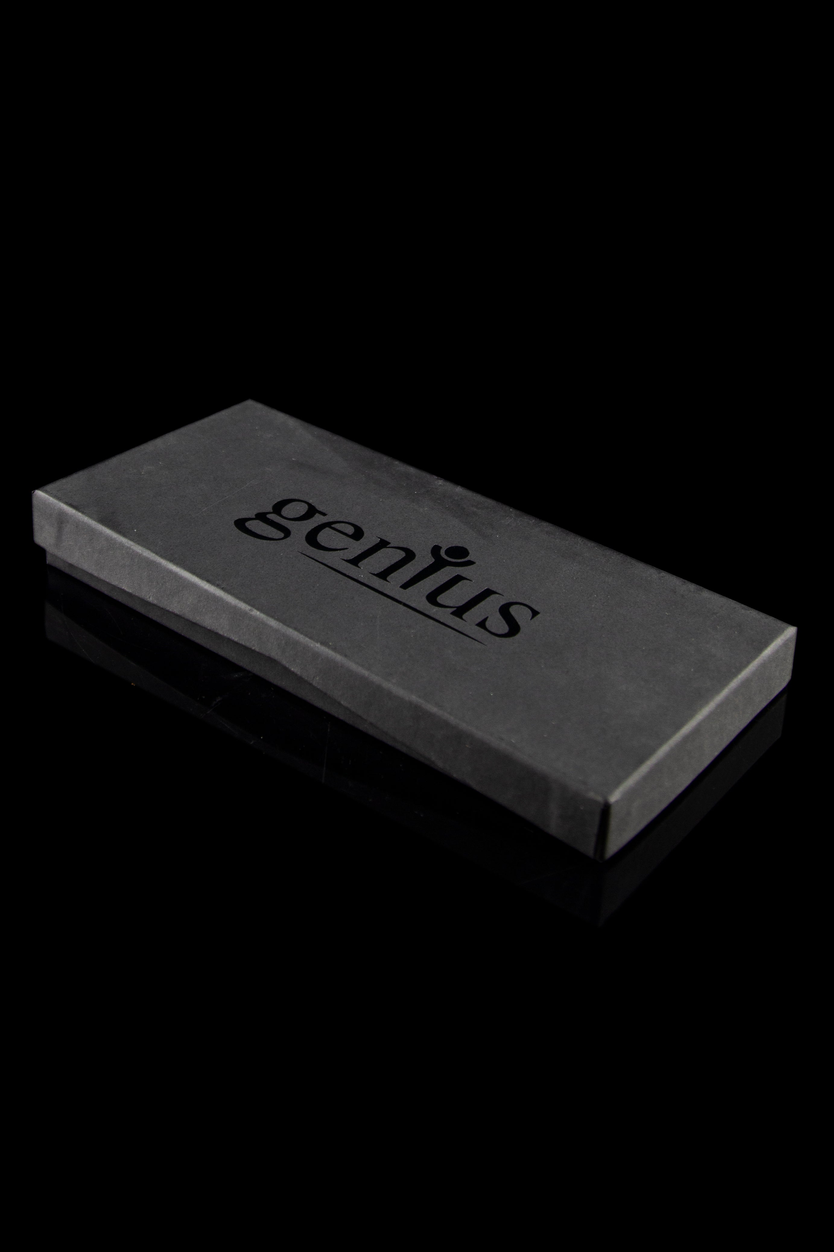 Black box with “genius” printed in white, likely containing a cannabis accessory.
