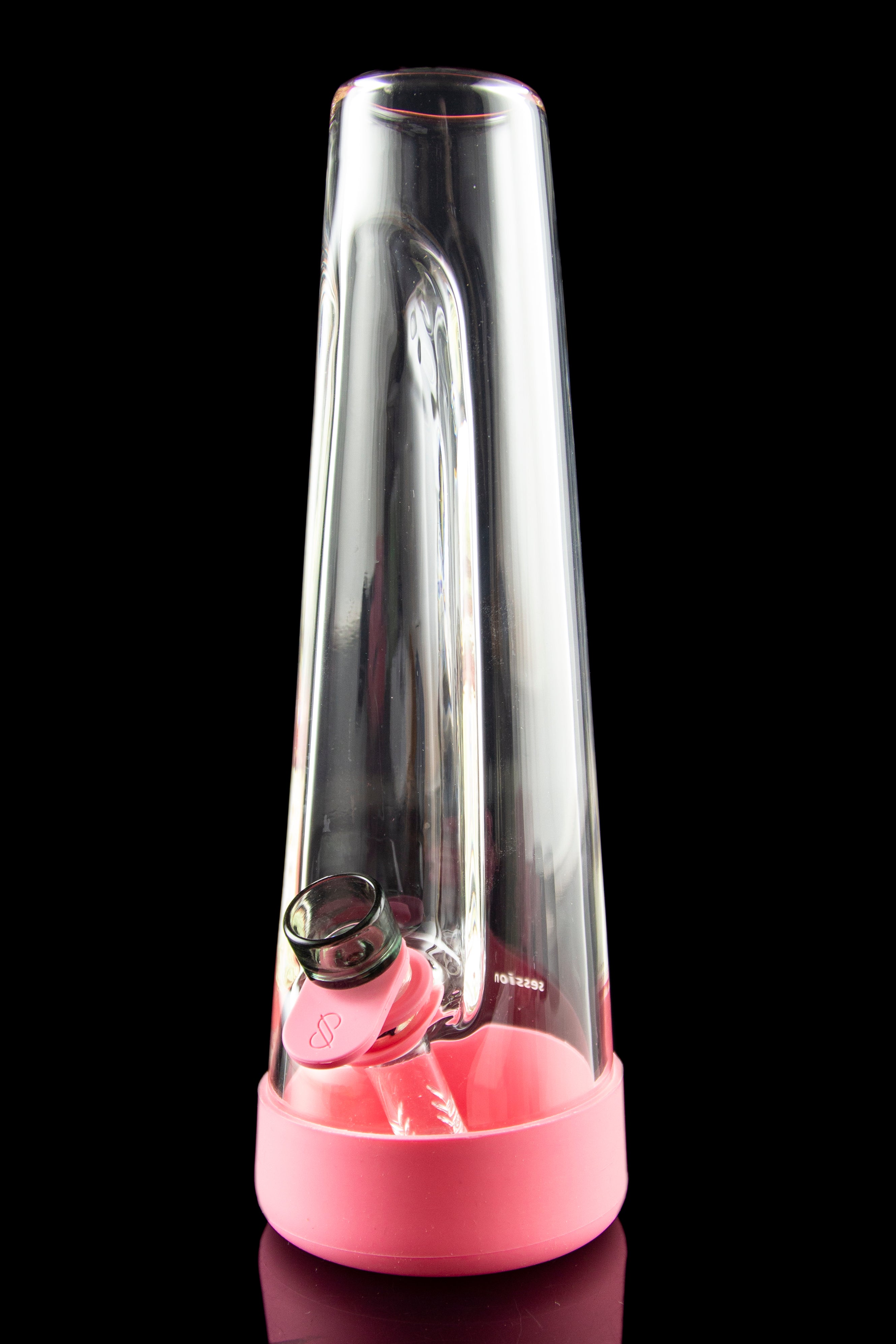 Pink glass water pipe with a clear glass downstem and bowl, reflecting on a glossy surface.