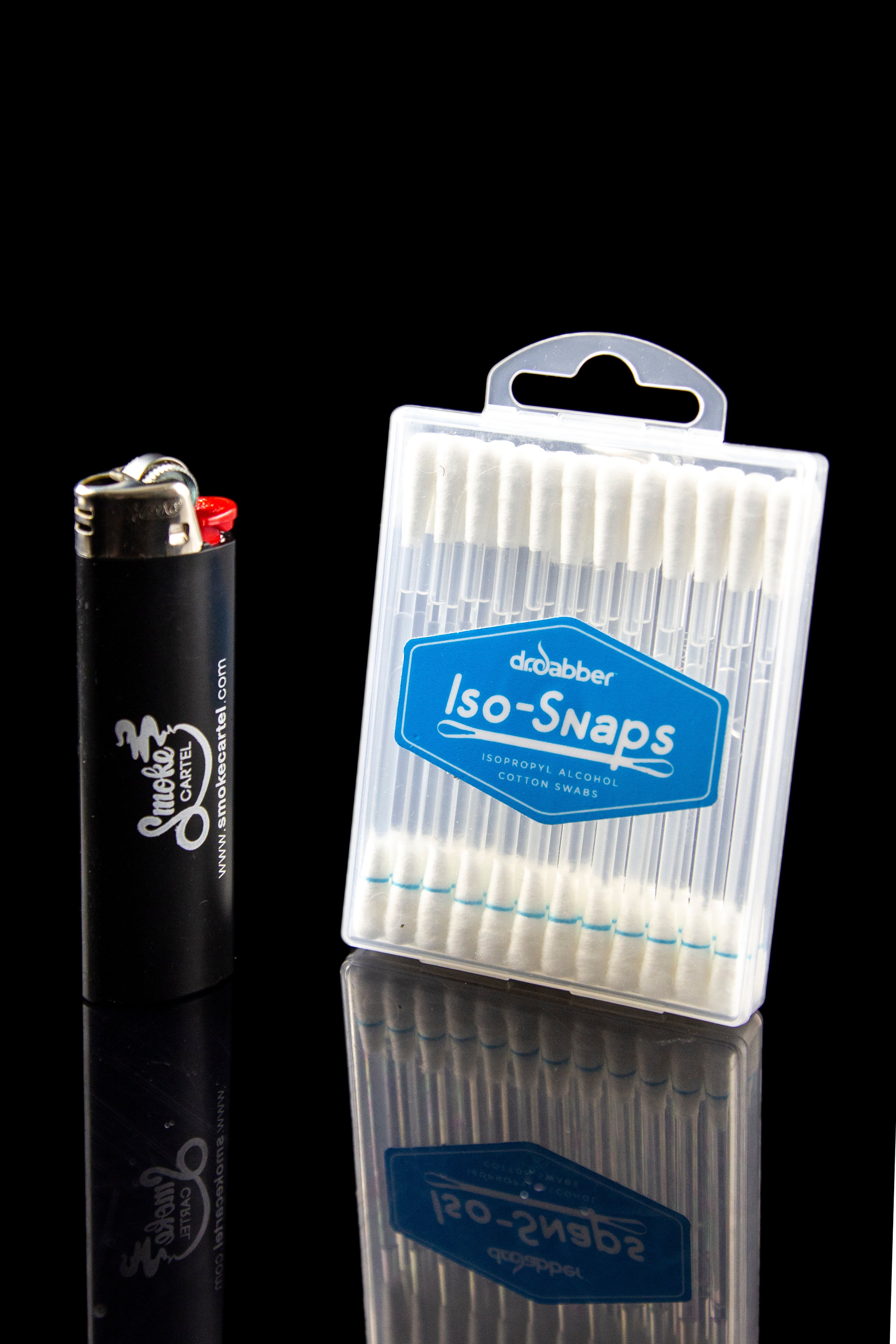 A lighter and a pack of isopropyl alcohol cotton swabs, used for cleaning cannabis tools, displayed on a reflective surface.