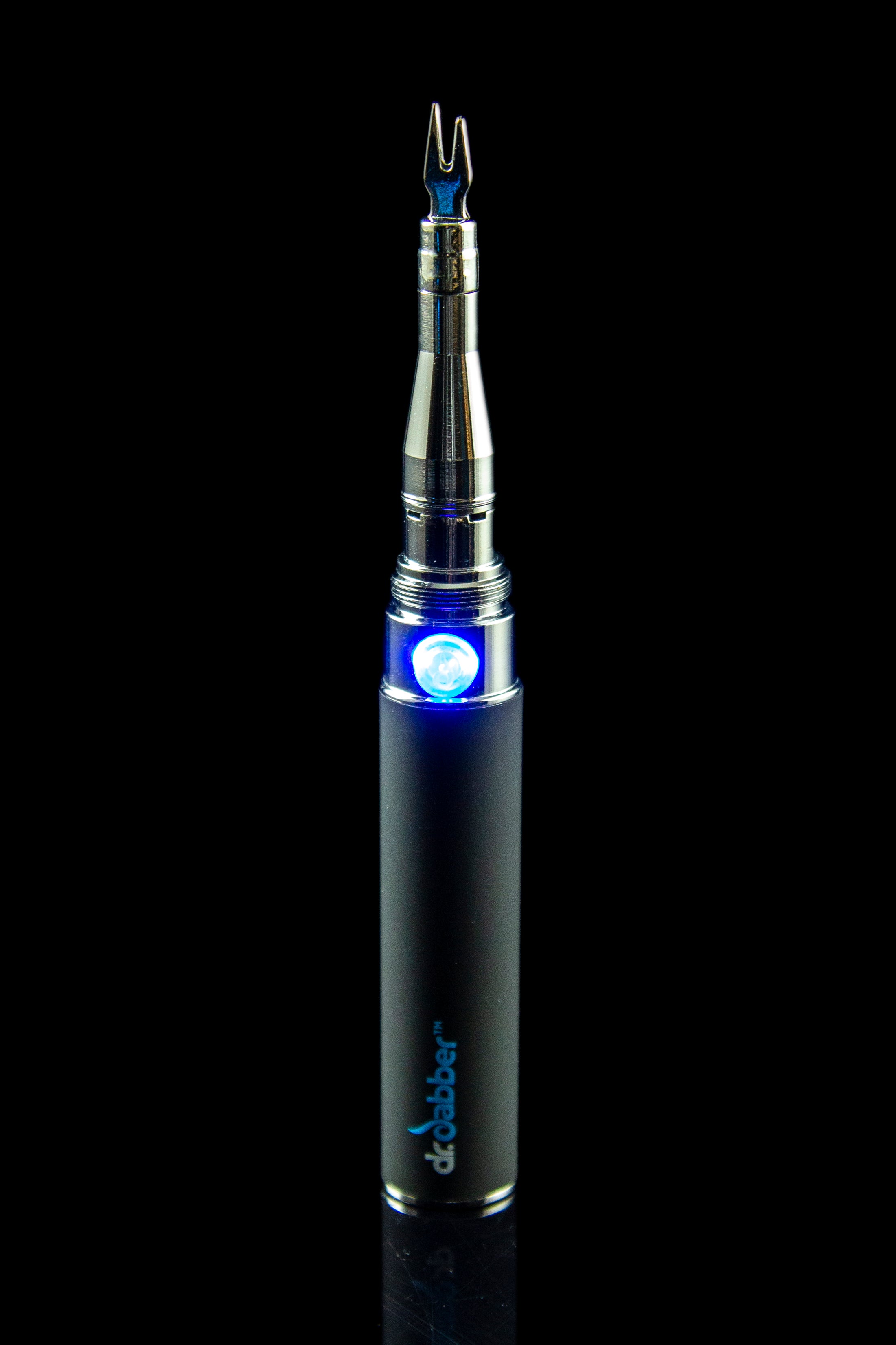 Close-up studio shot of the Dr. Dabber Budder Cutter, showcasing its sleek, metallic design against a dark background.