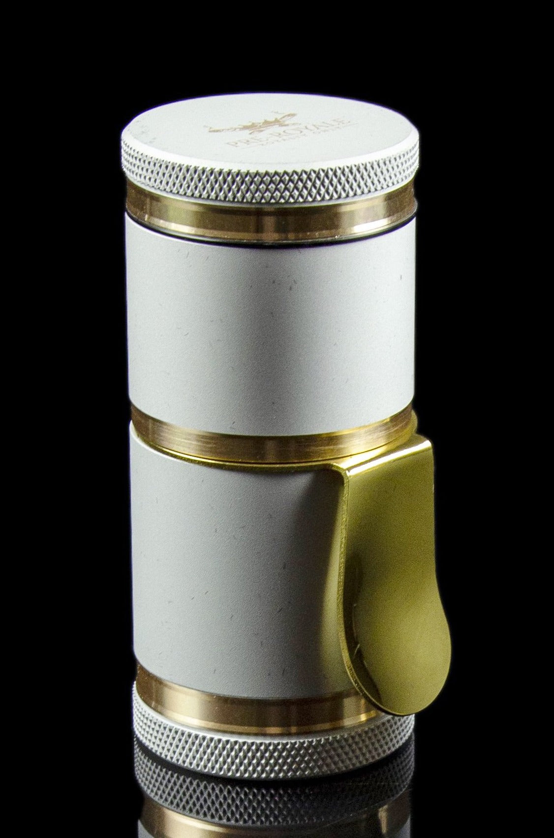 White and gold cannabis grinder with a rotating chamber and textured grip, isolated on a black background.