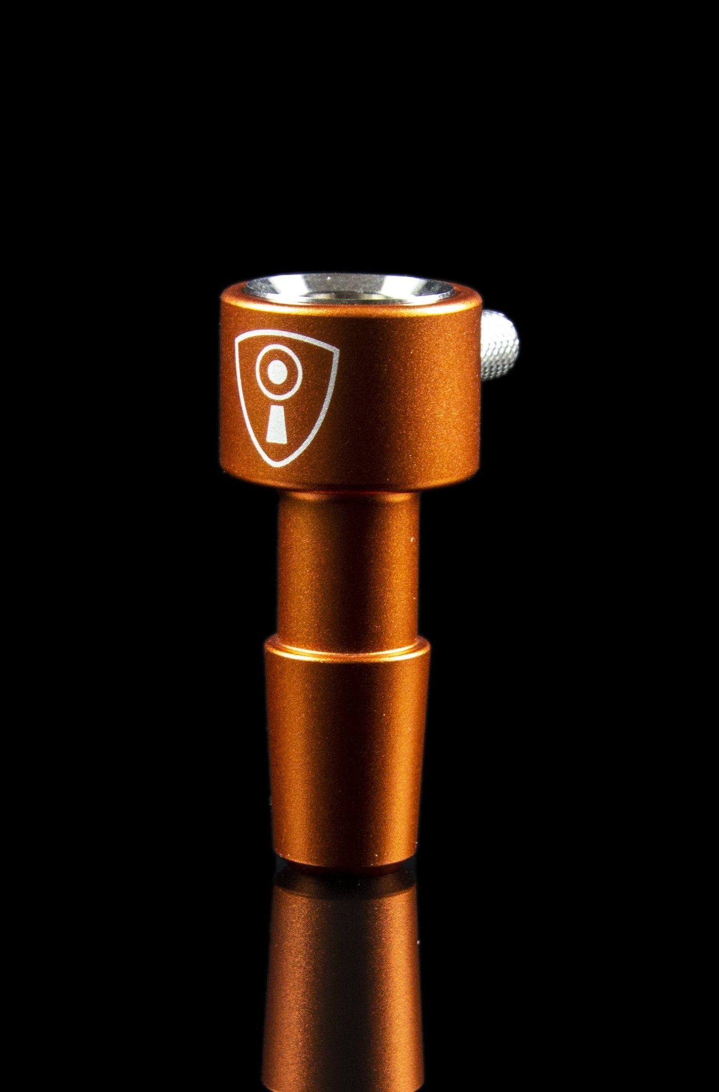 Copper-colored cannabis dab rig with a shield-shaped logo.