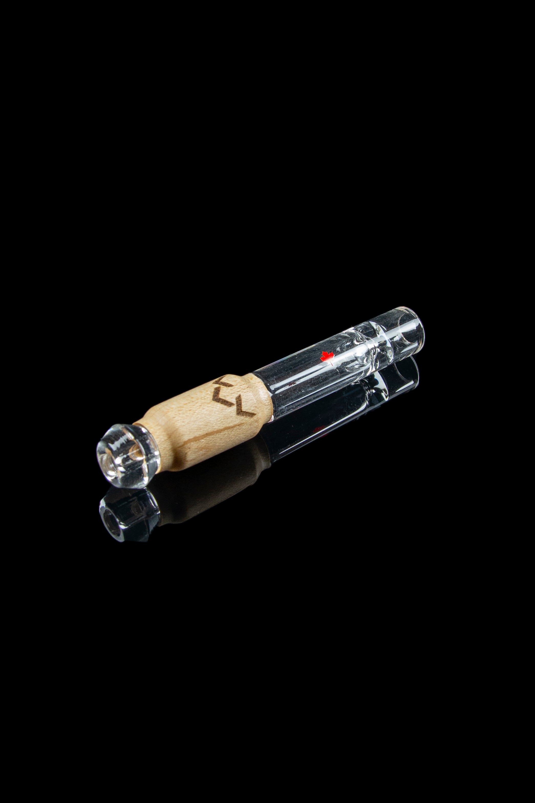 Glass pipe with a wooden mouthpiece, isolated on black.