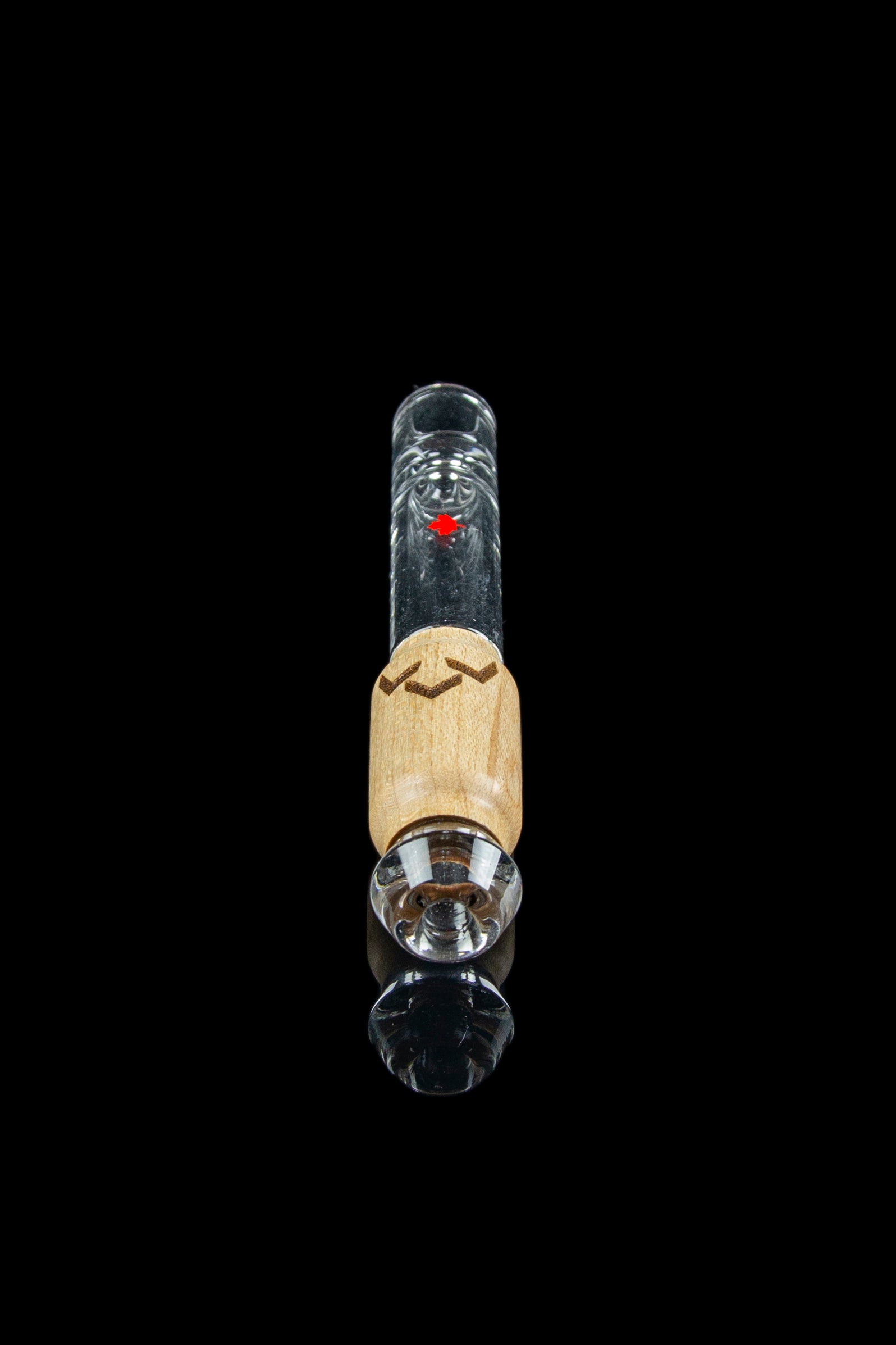 Glass dab rig with wooden accent and clear glass components, isolated on black.