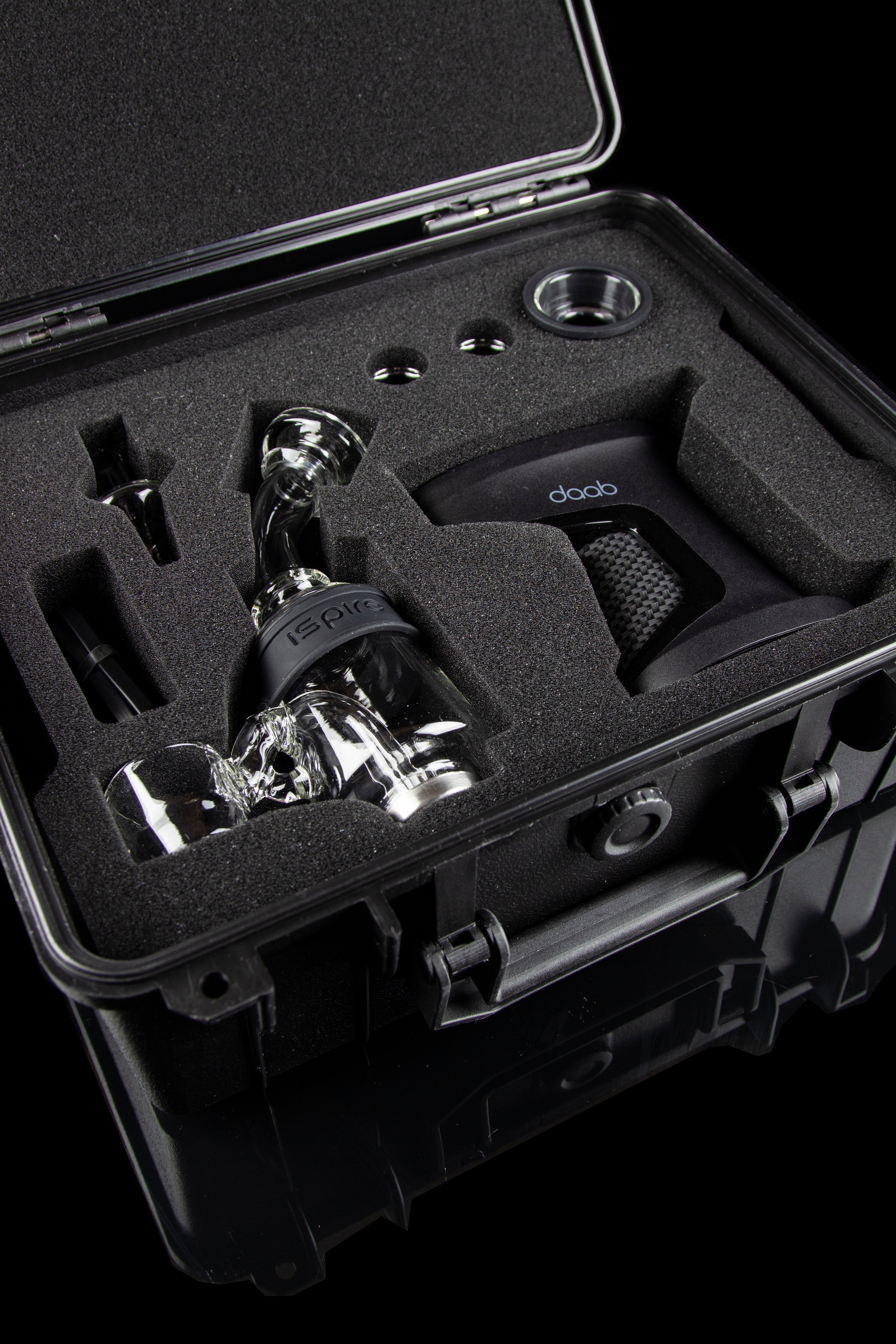 Dab rig and accessories nestled in a protective, foam-lined carrying case.