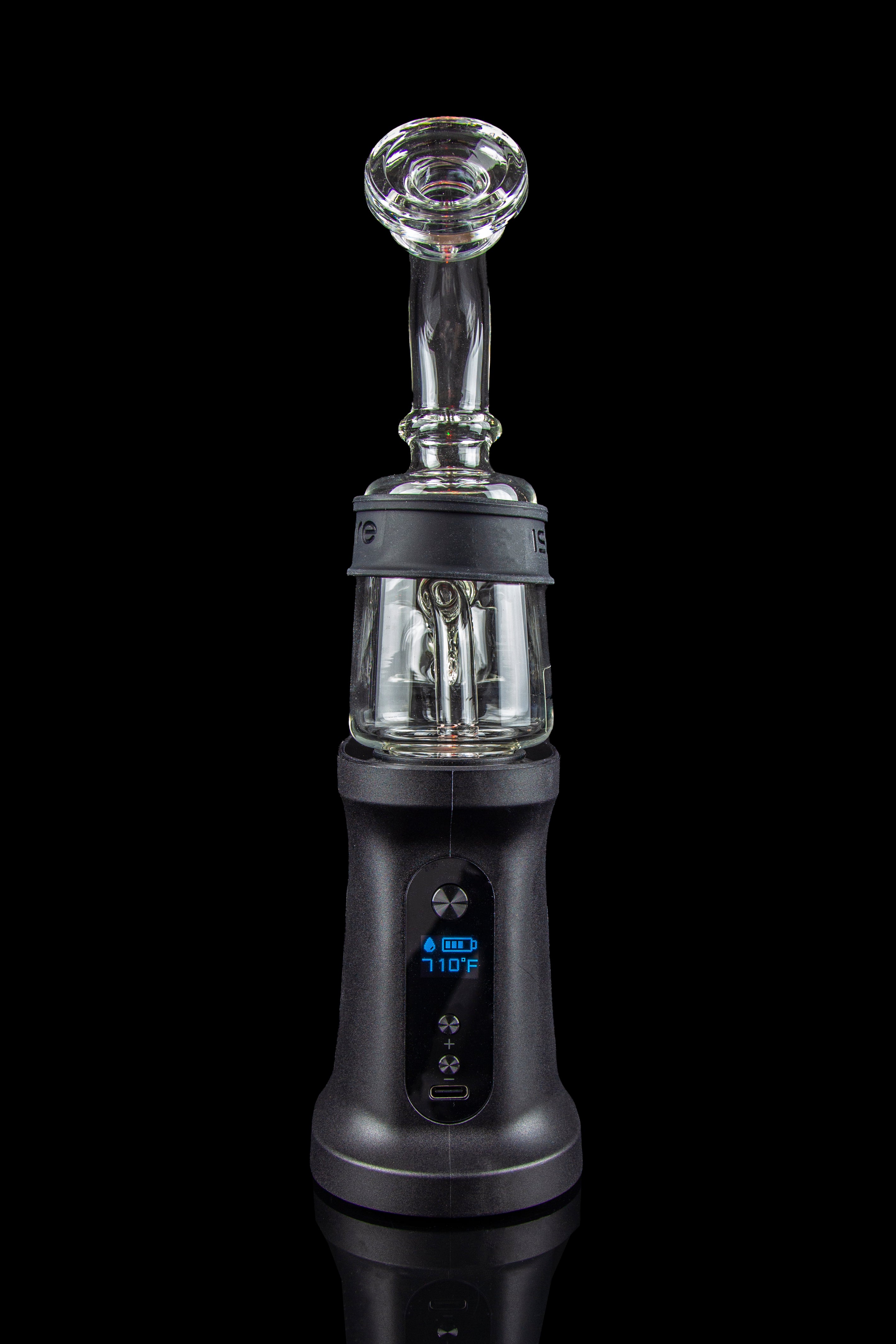 Black cannabis e-rig with a glass water pipe attachment, displaying a temperature of 710°F on its digital screen.