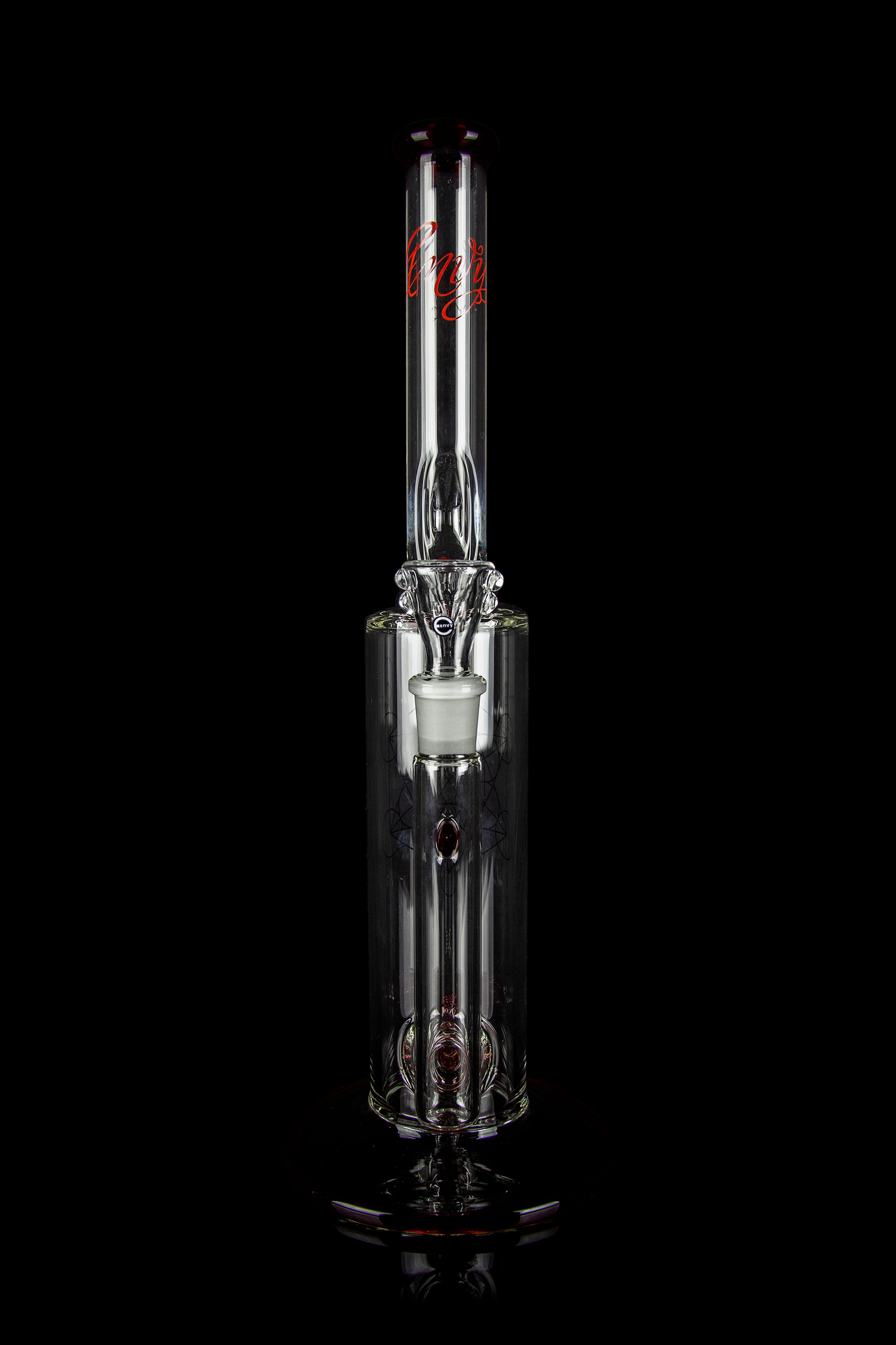 Glass cannabis water pipe (rig) with intricate striped design and visible bowl, isolated on black.