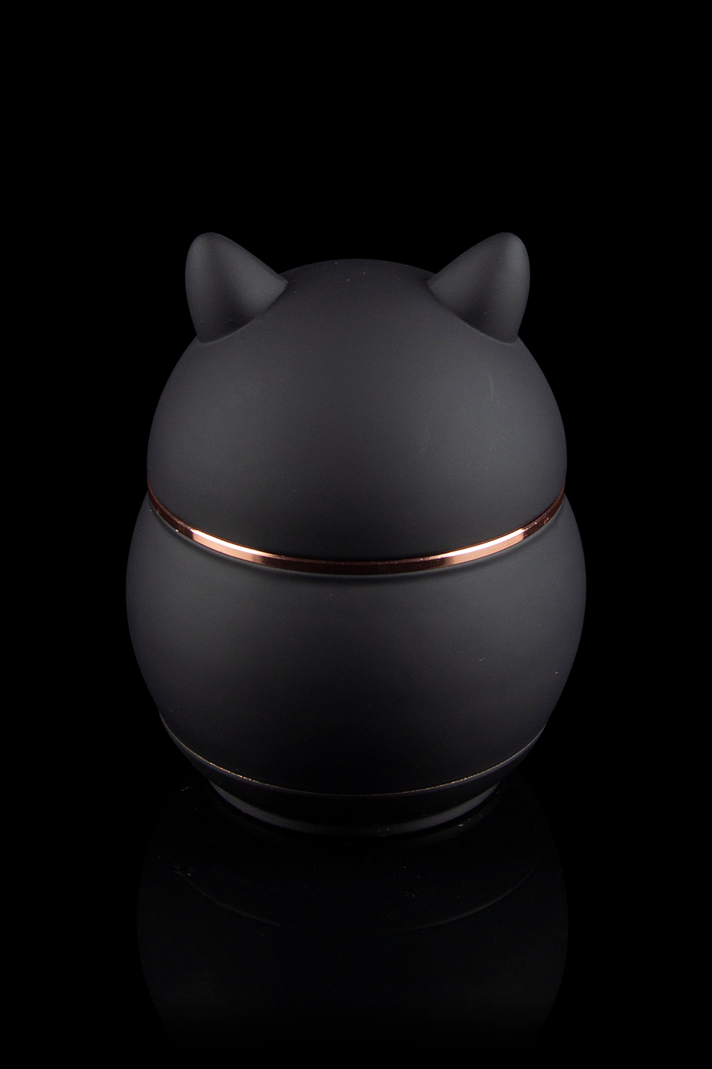 Sleek black cannabis storage jar with copper accents and cat-ear lid.