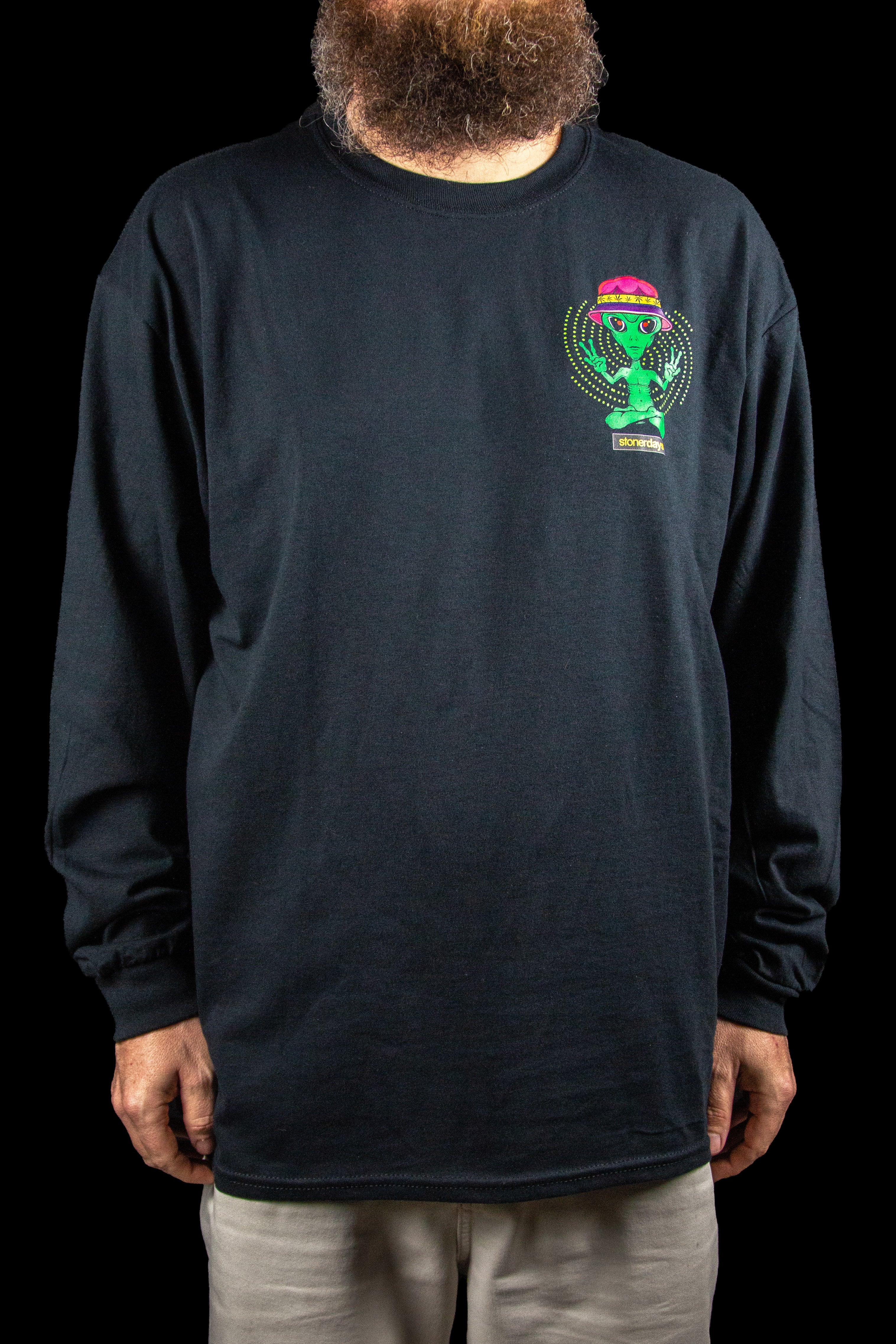 Long-sleeved black t-shirt with a colorful alien graphic on the chest.