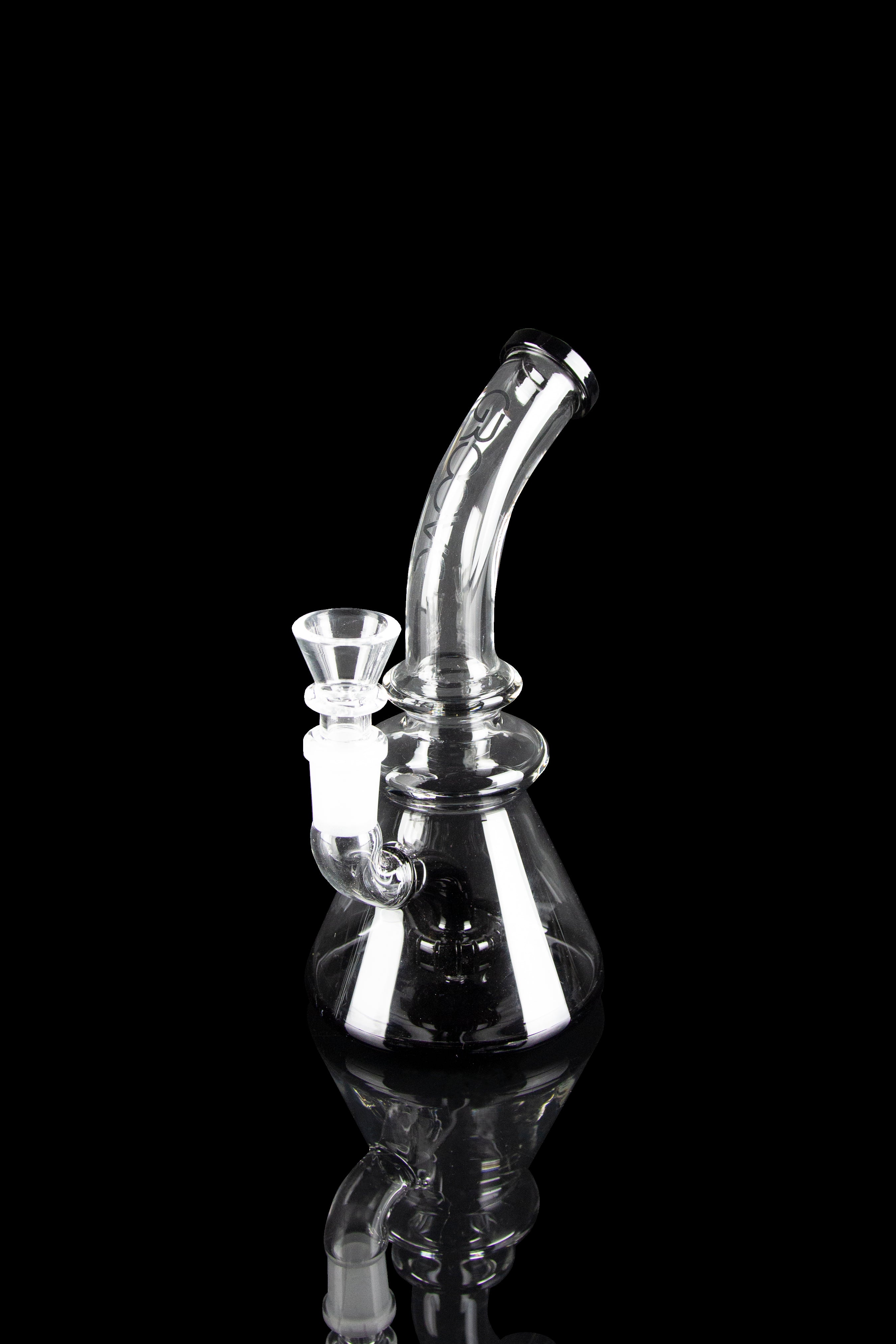 Clear glass water pipe (bong) with intricate curves and a glass bowl, isolated on a black background.