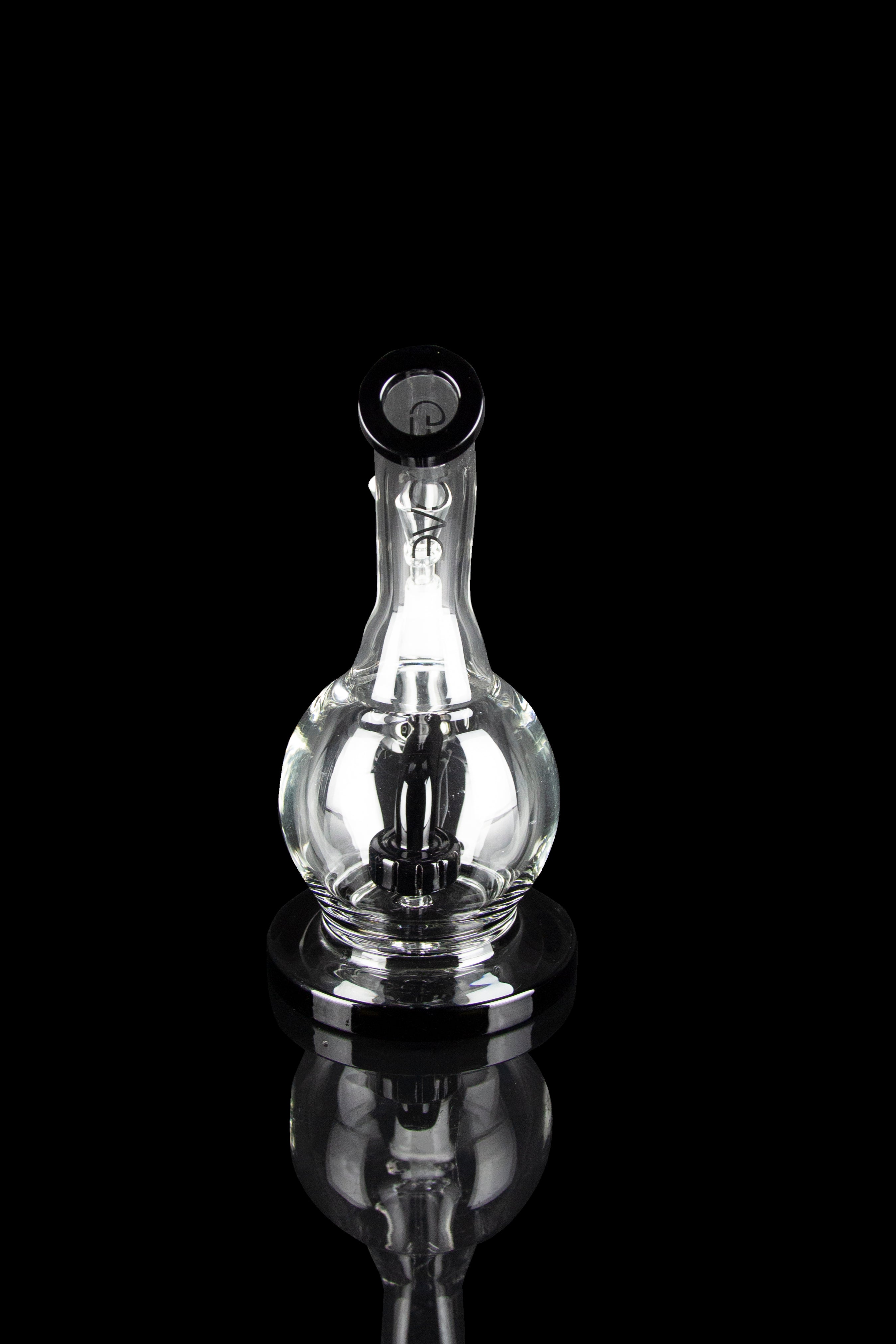 Clear glass water pipe (rig) with intricate percolator design, isolated on a black reflective surface.