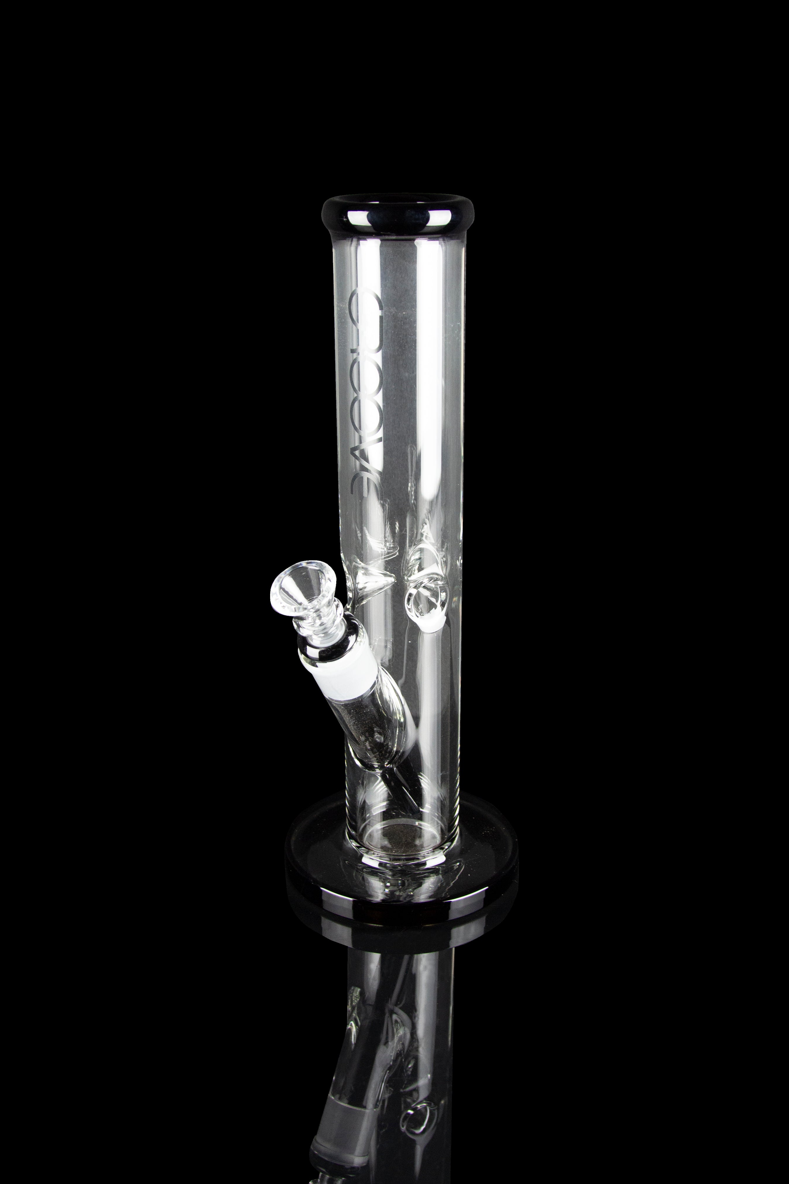 Clear glass water pipe (bong) with ice catcher, studio shot on black.