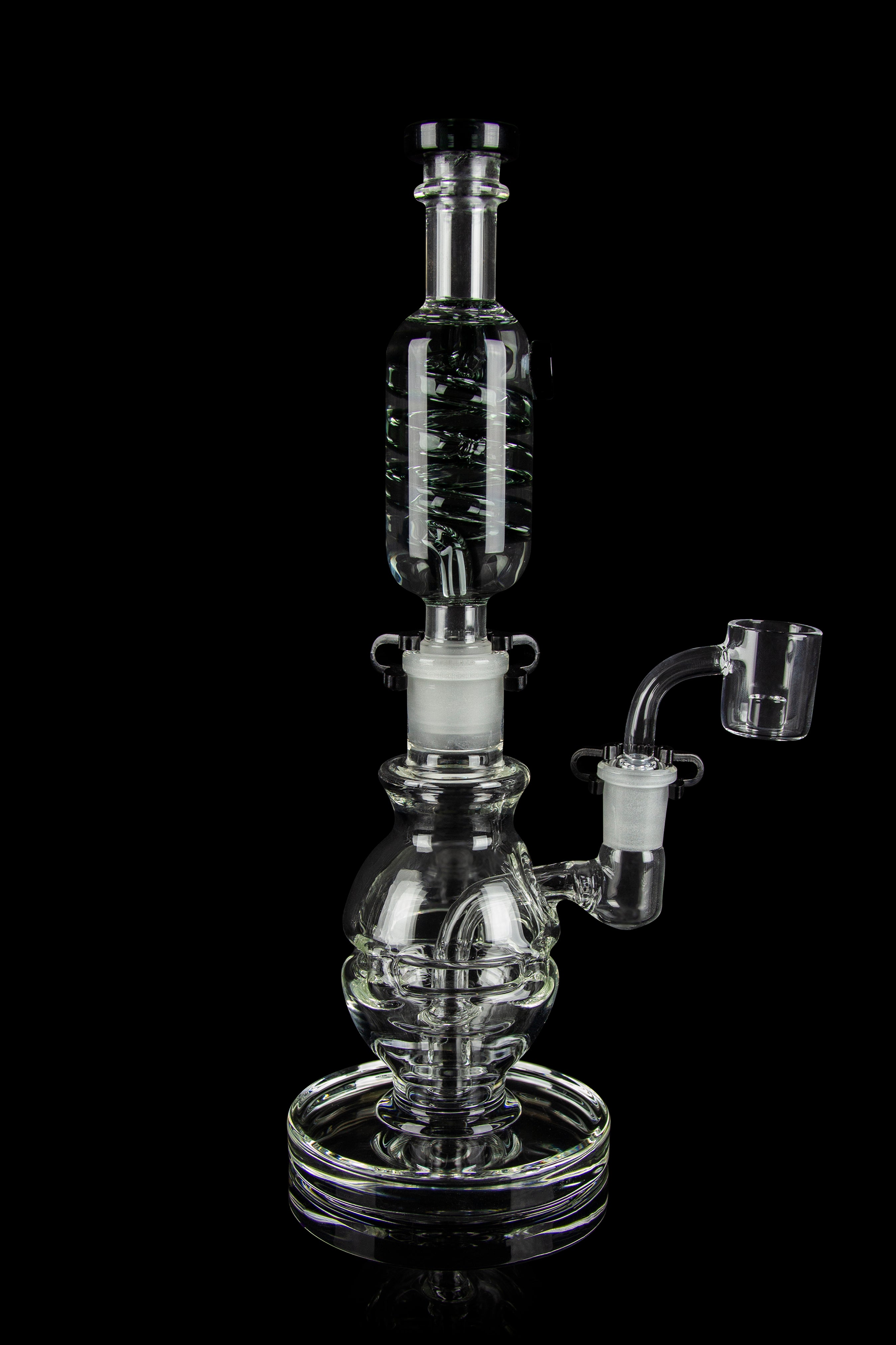 Clear glass water pipe (rig) with bubbler and quartz banger, isolated on a black background.