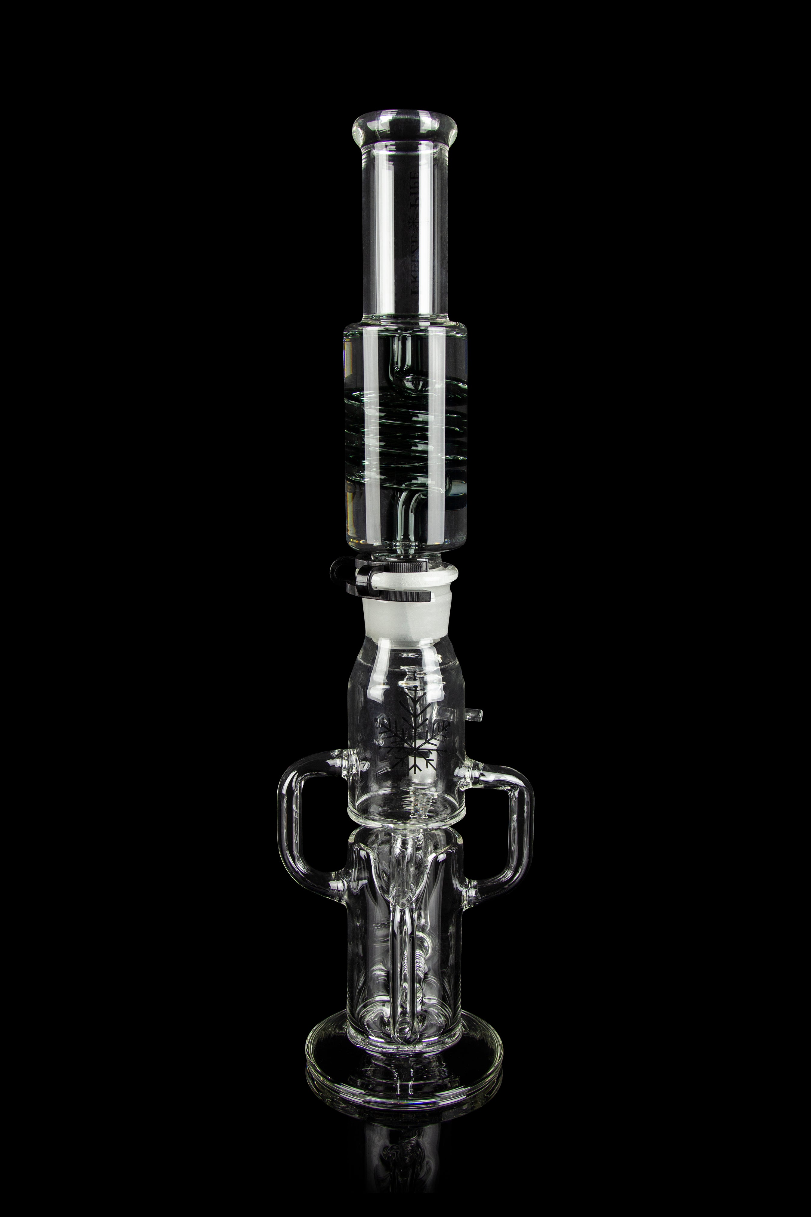 Clear glass water pipe (rig) with multiple chambers and percolators, isolated on a black background.