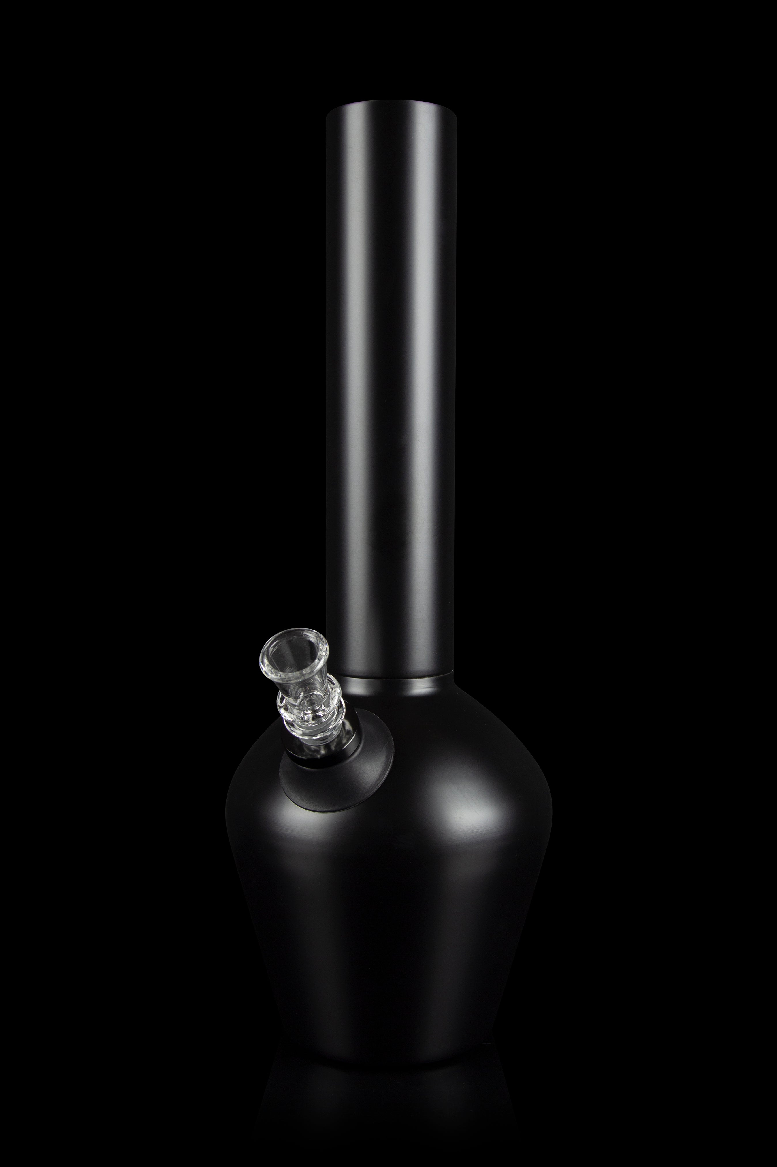 Black glass water pipe (bong) with a clear glass bowl against a dark background.