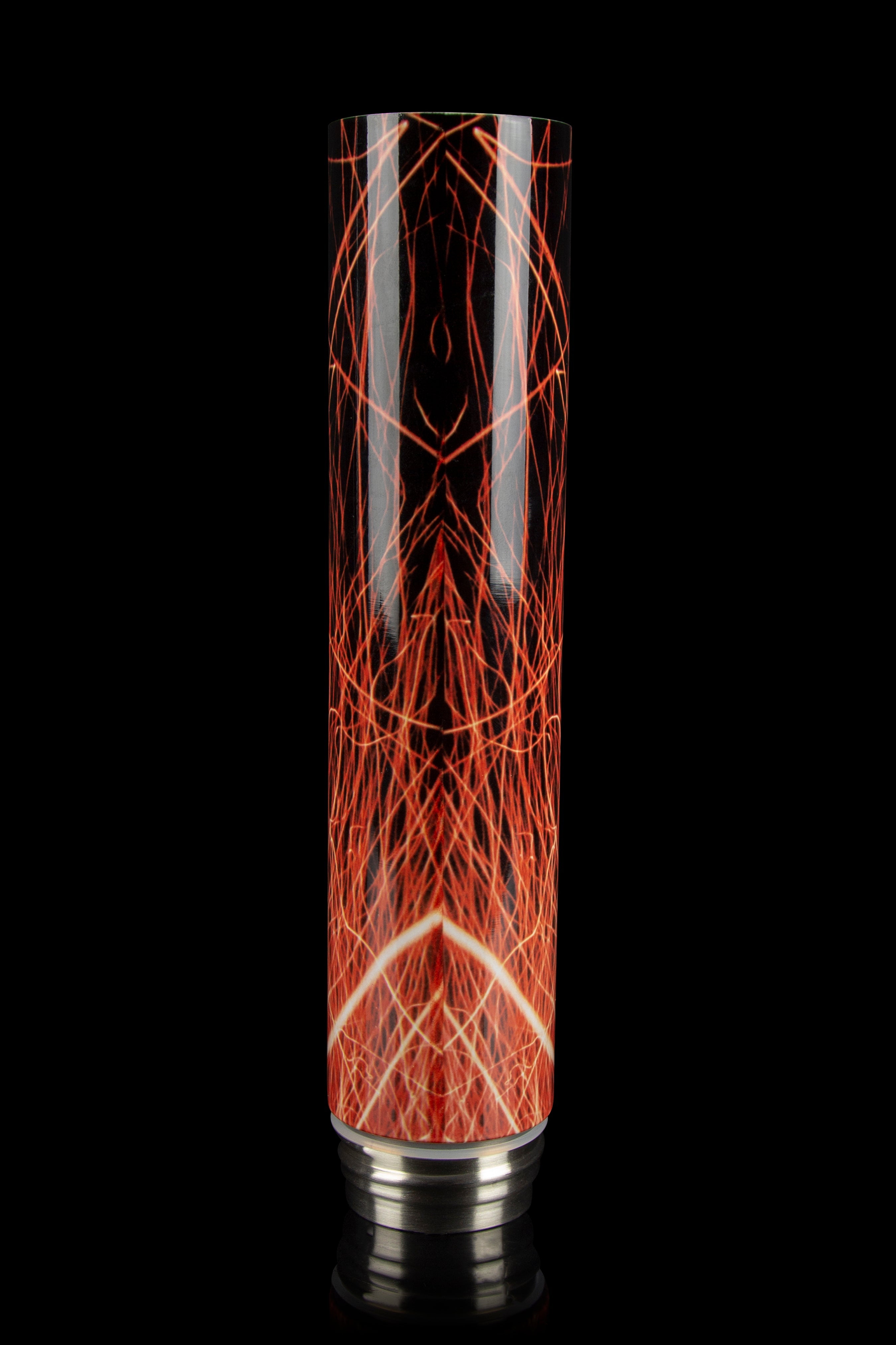 Red and white patterned glass bubbler with a silver base, isolated on a black background.