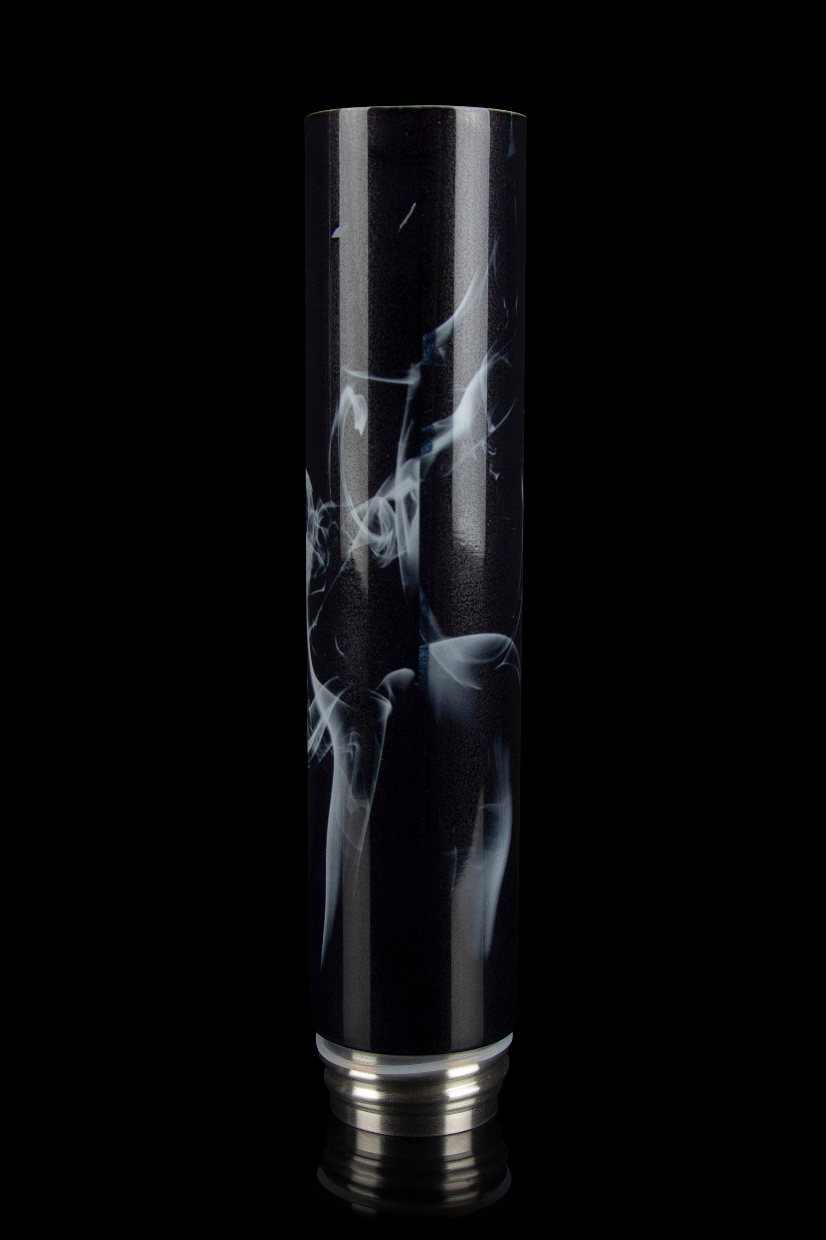 Black glass bong with swirling white smoke pattern, isolated on a black background.