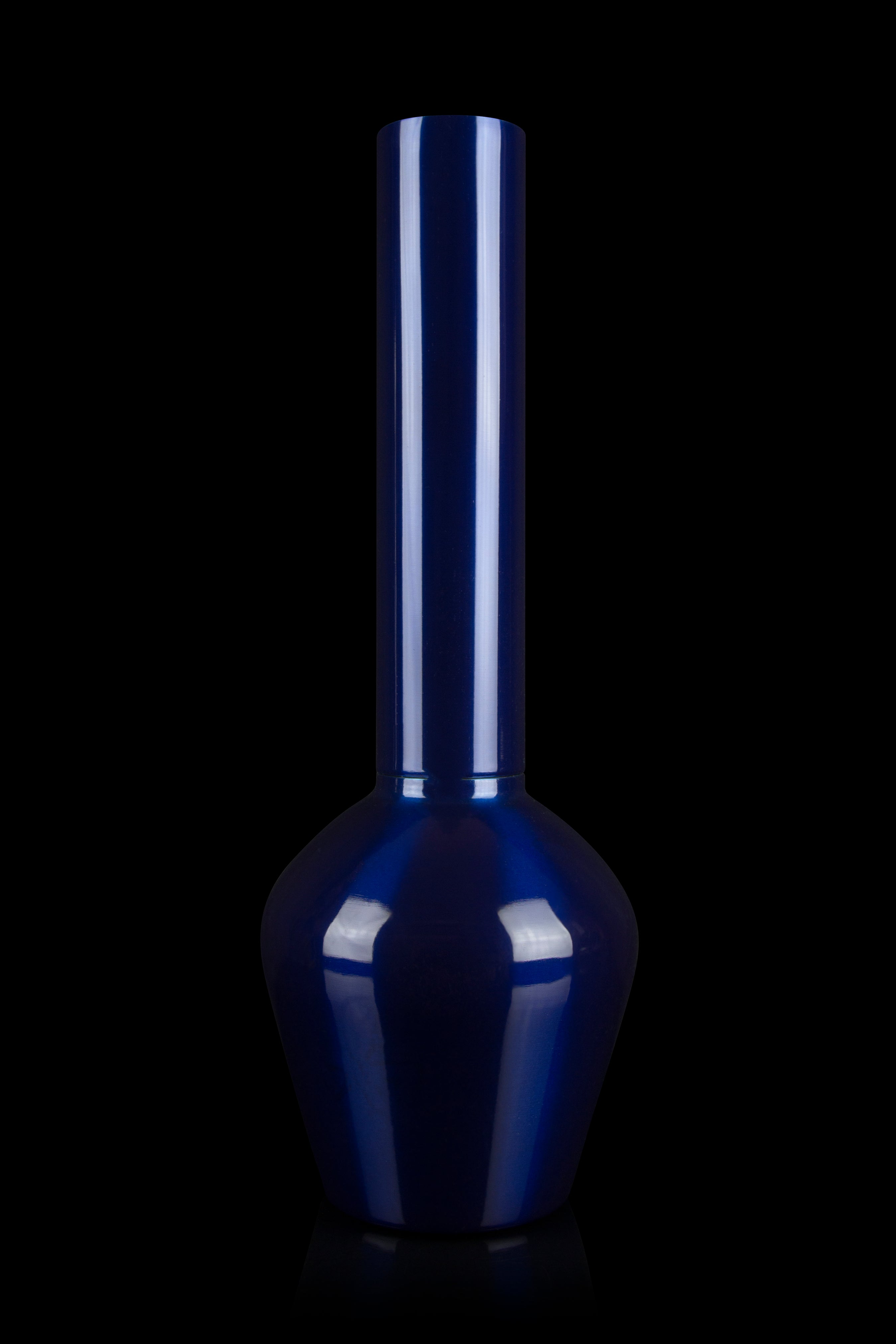 Blue glass bong against a black background.