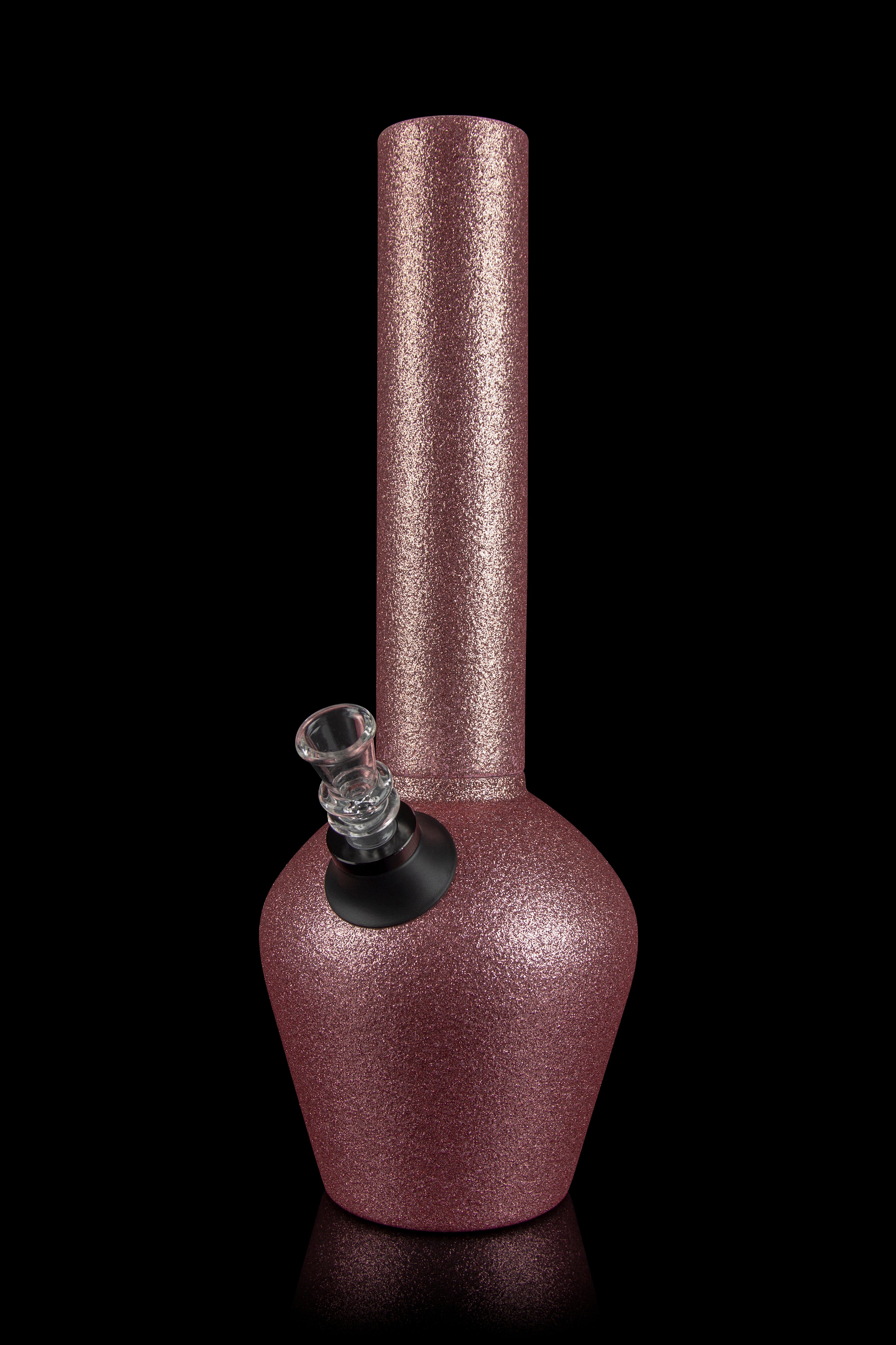 Red speckled glass water pipe with a clear glass bowl on a black reflective surface.