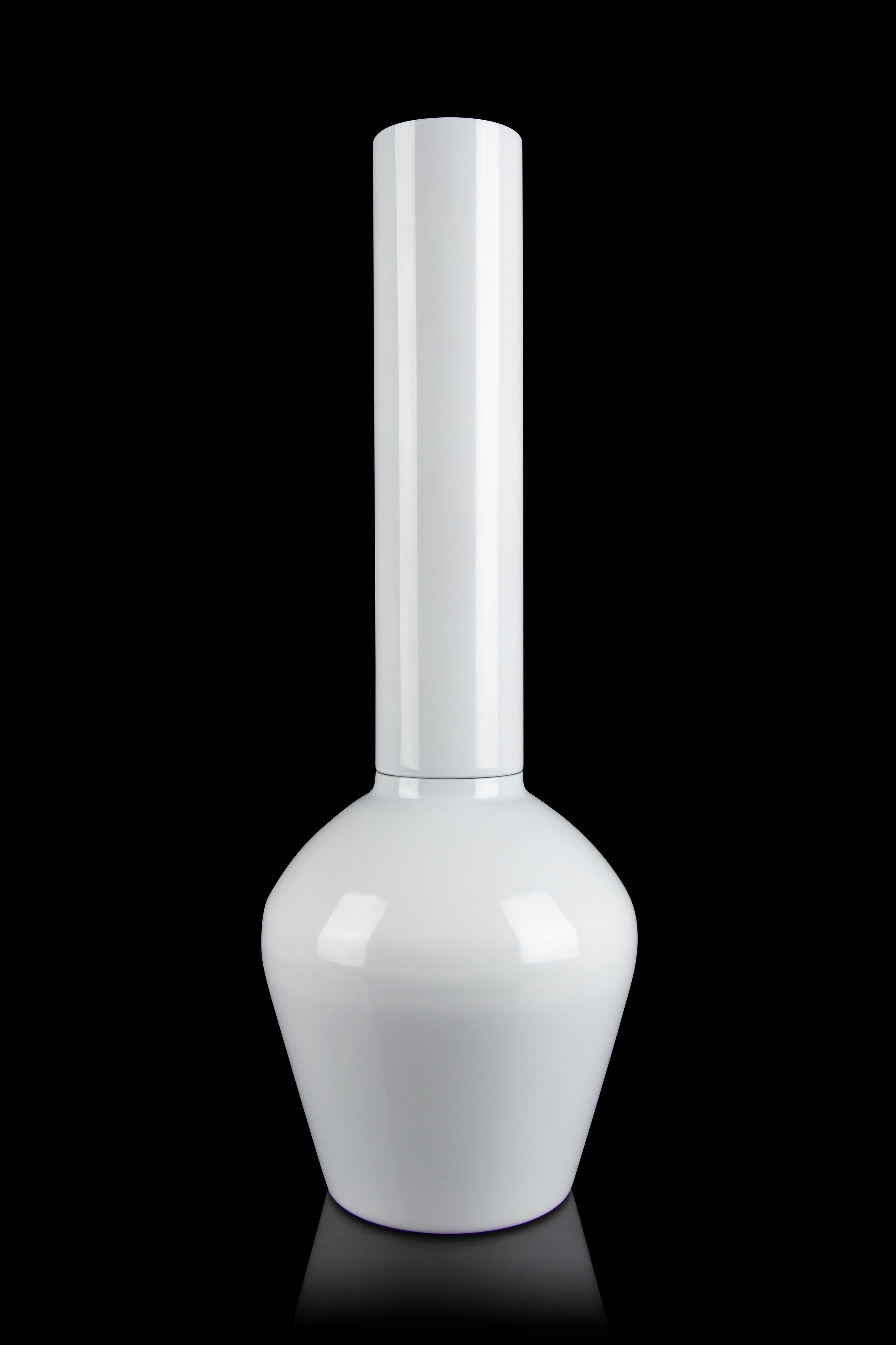 White glass bong isolated on a black background.