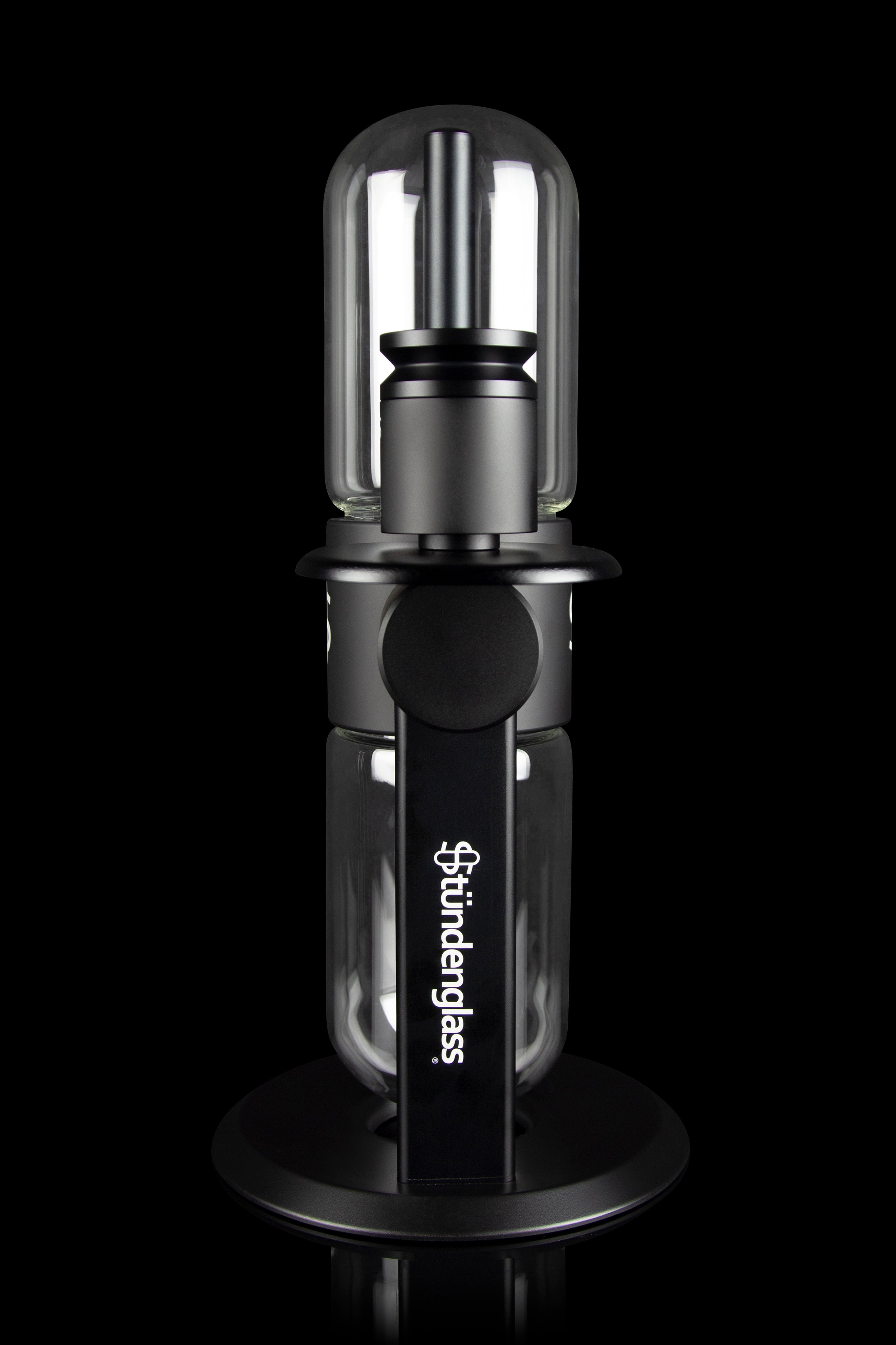 Sündglass black silicone nectar collector with glass tip, isolated on a black background.