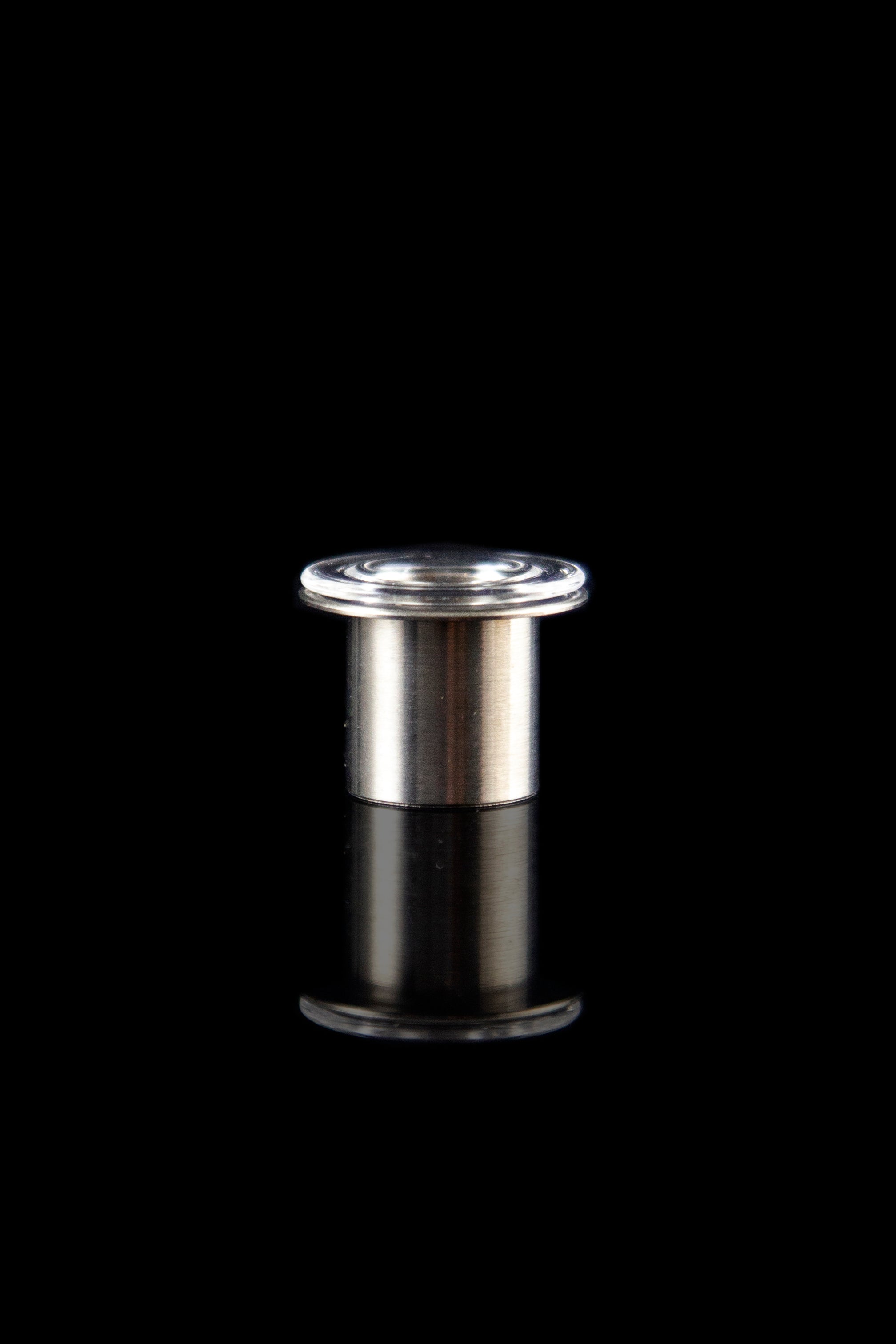 Silver oil rig carb cap against a black background.