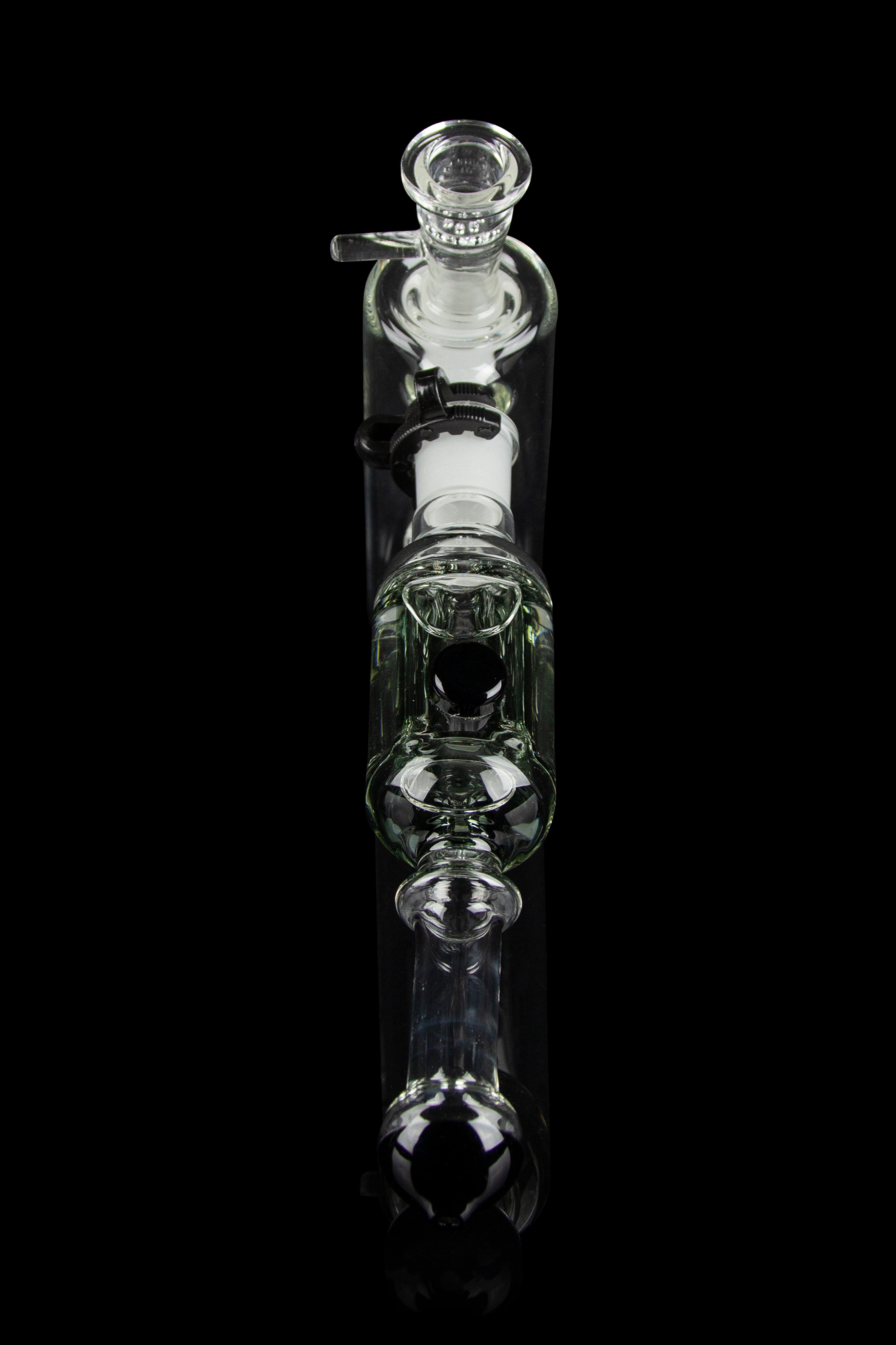 Clear glass bubbler water pipe against a black background.
