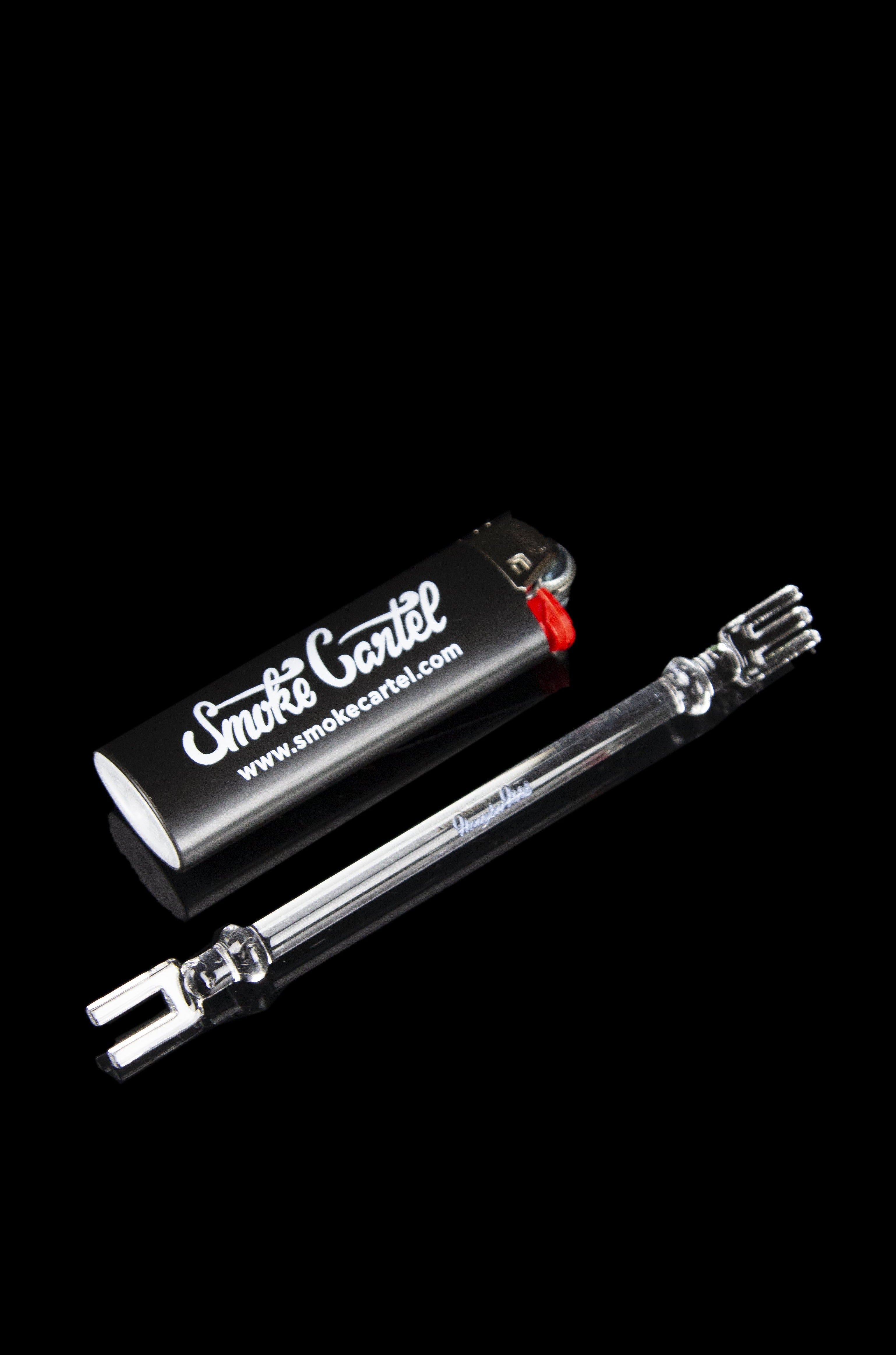 Glass bubbler pipes and a branded lighter on a black background.