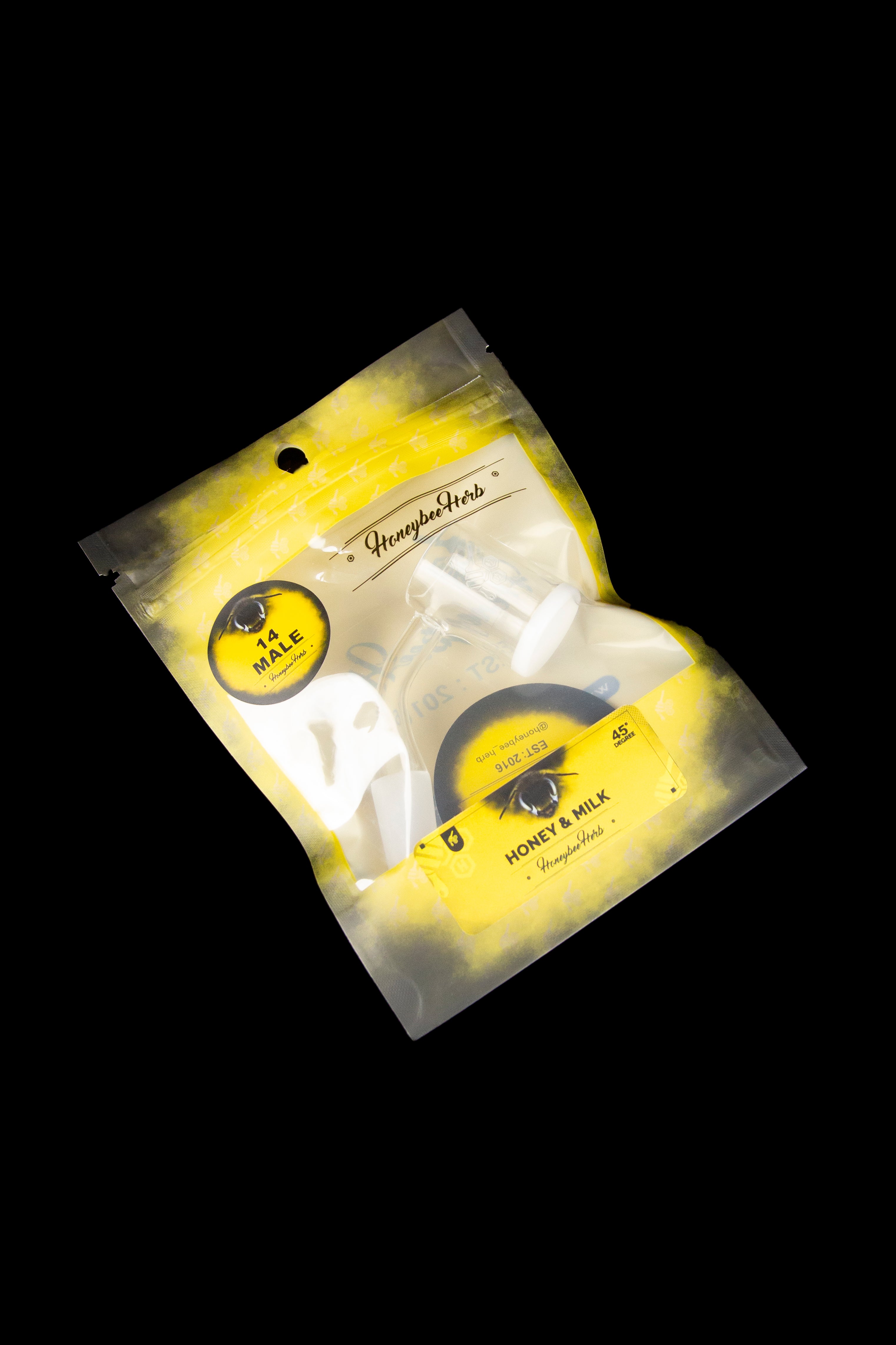 Yellow mylar bag of “Honeybee Herbs” cannabis, labeled “Honey & Milk” with strain details.