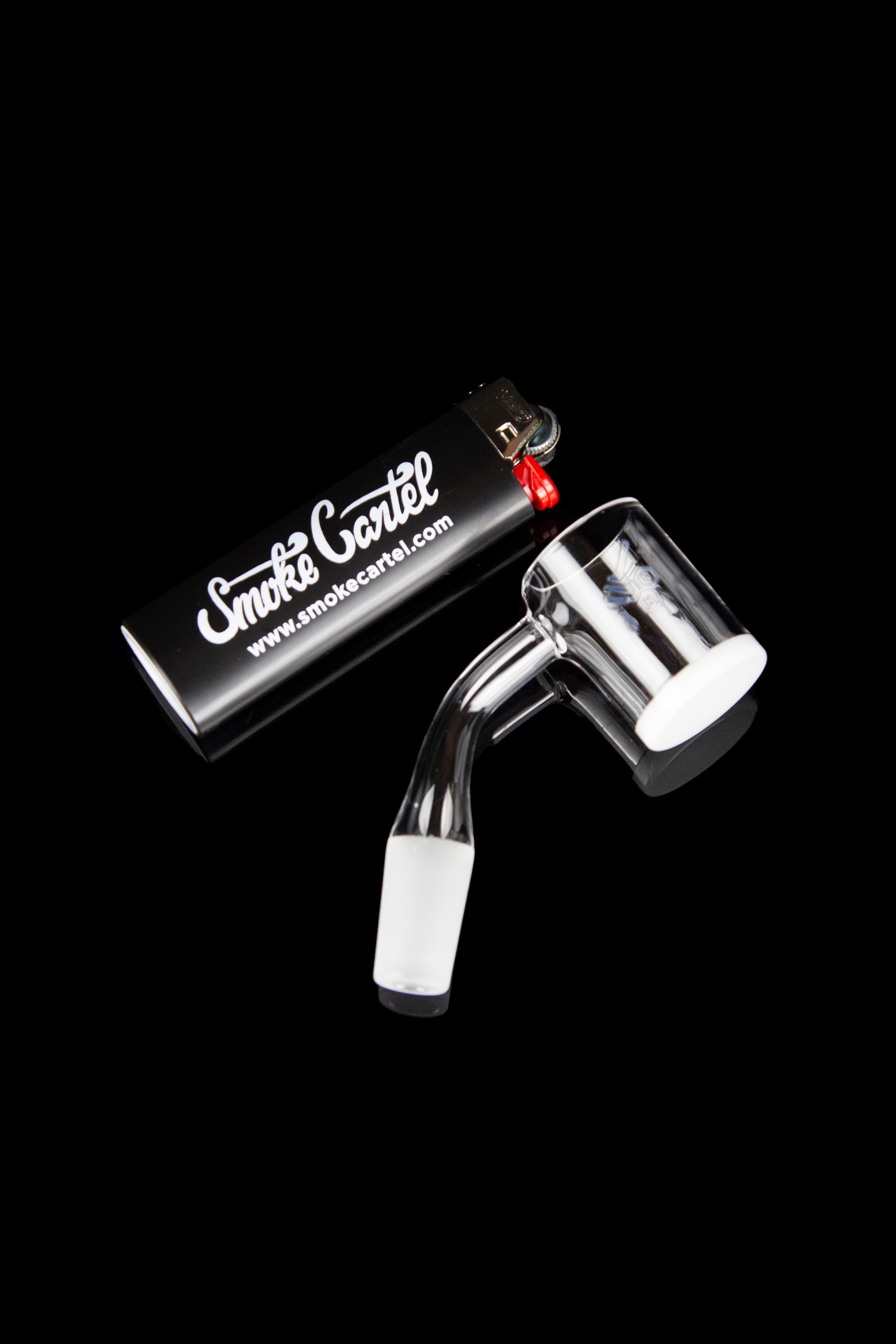 Quartz dab rig with clear glass mouthpiece and "Smoke Cartel" branding.