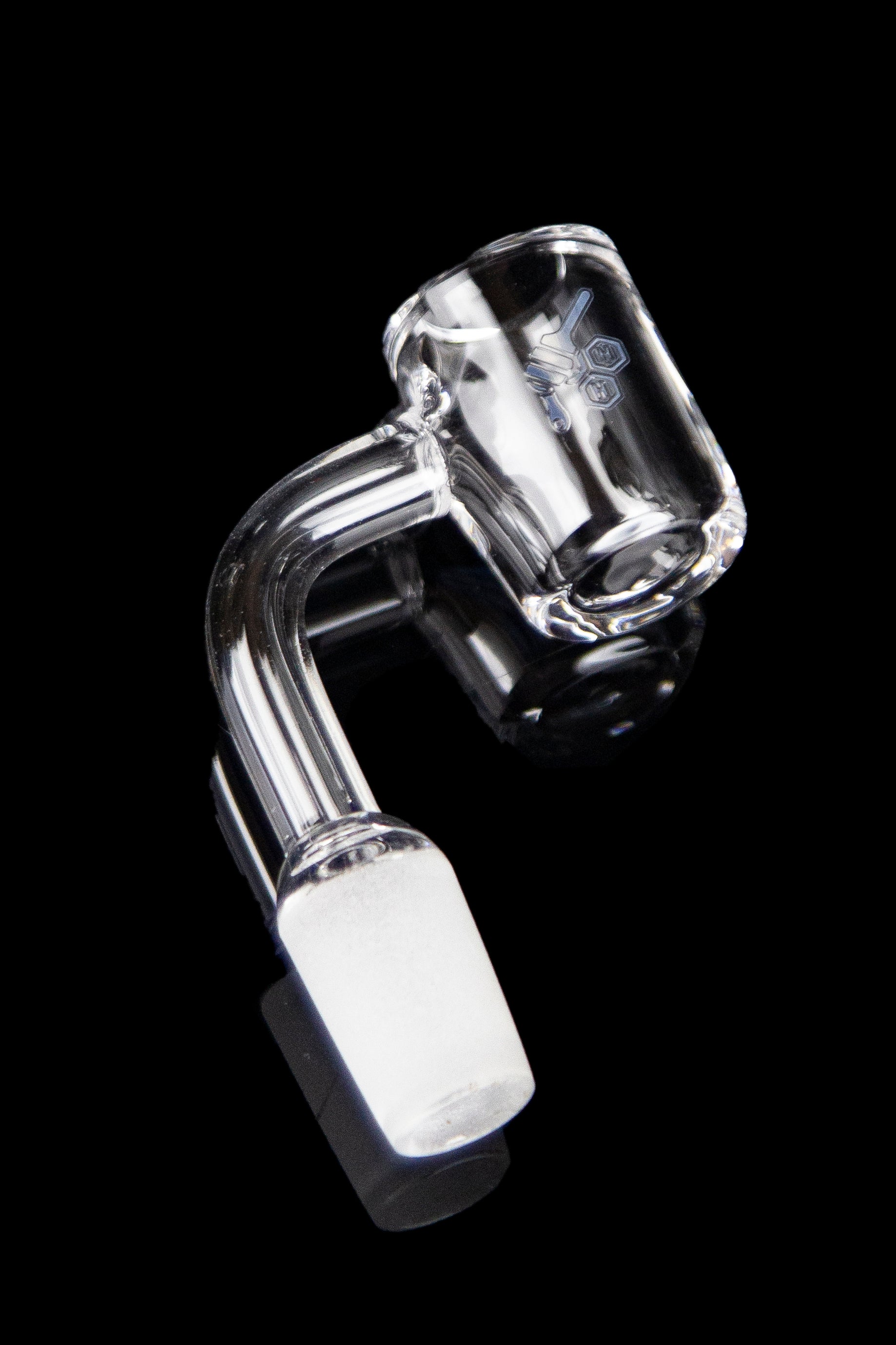 Clear glass dab rig nail with a bent design and angled tip, isolated on a black background.