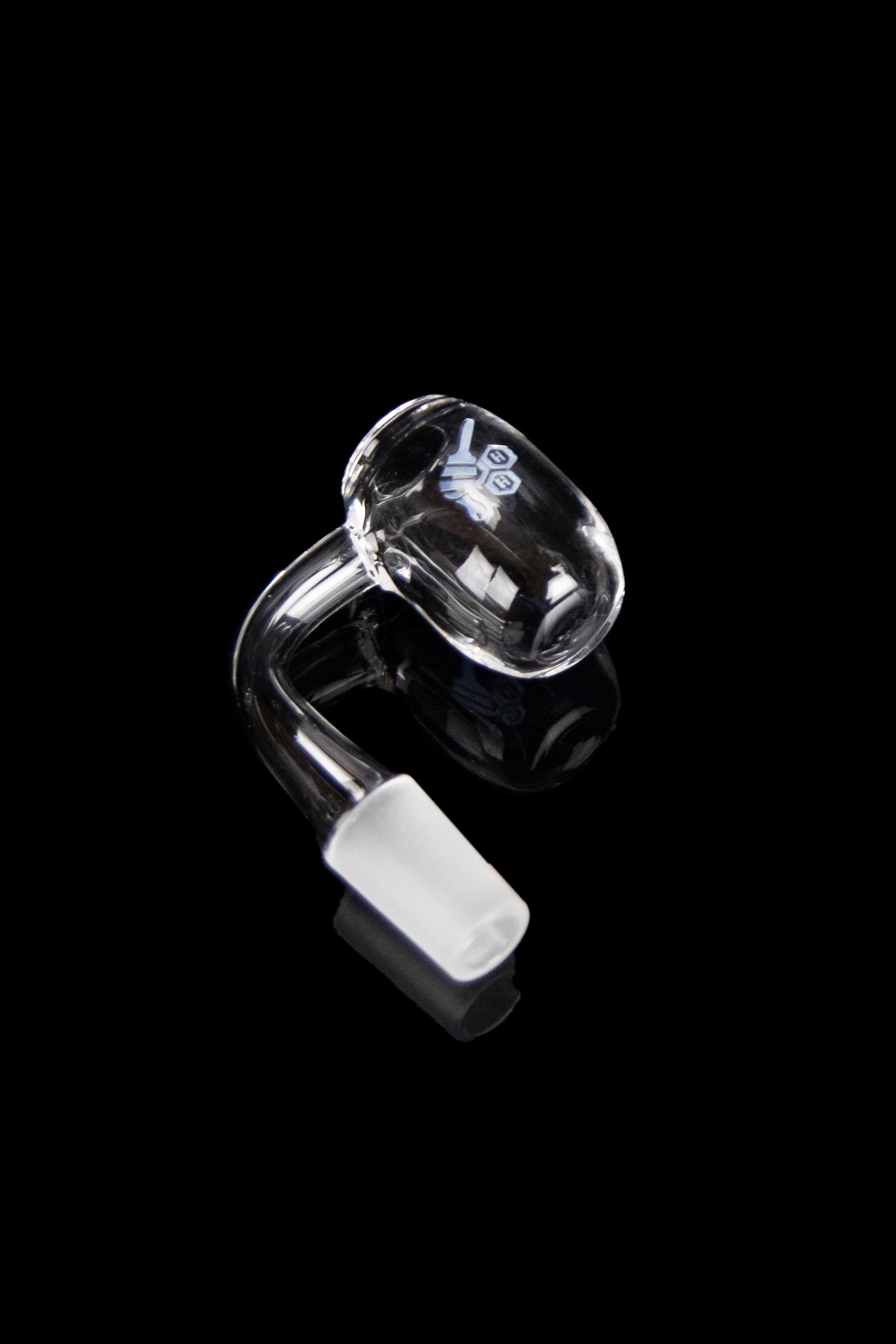 Clear quartz dab rig with a visible bucket and mouthpiece, isolated on a black background.