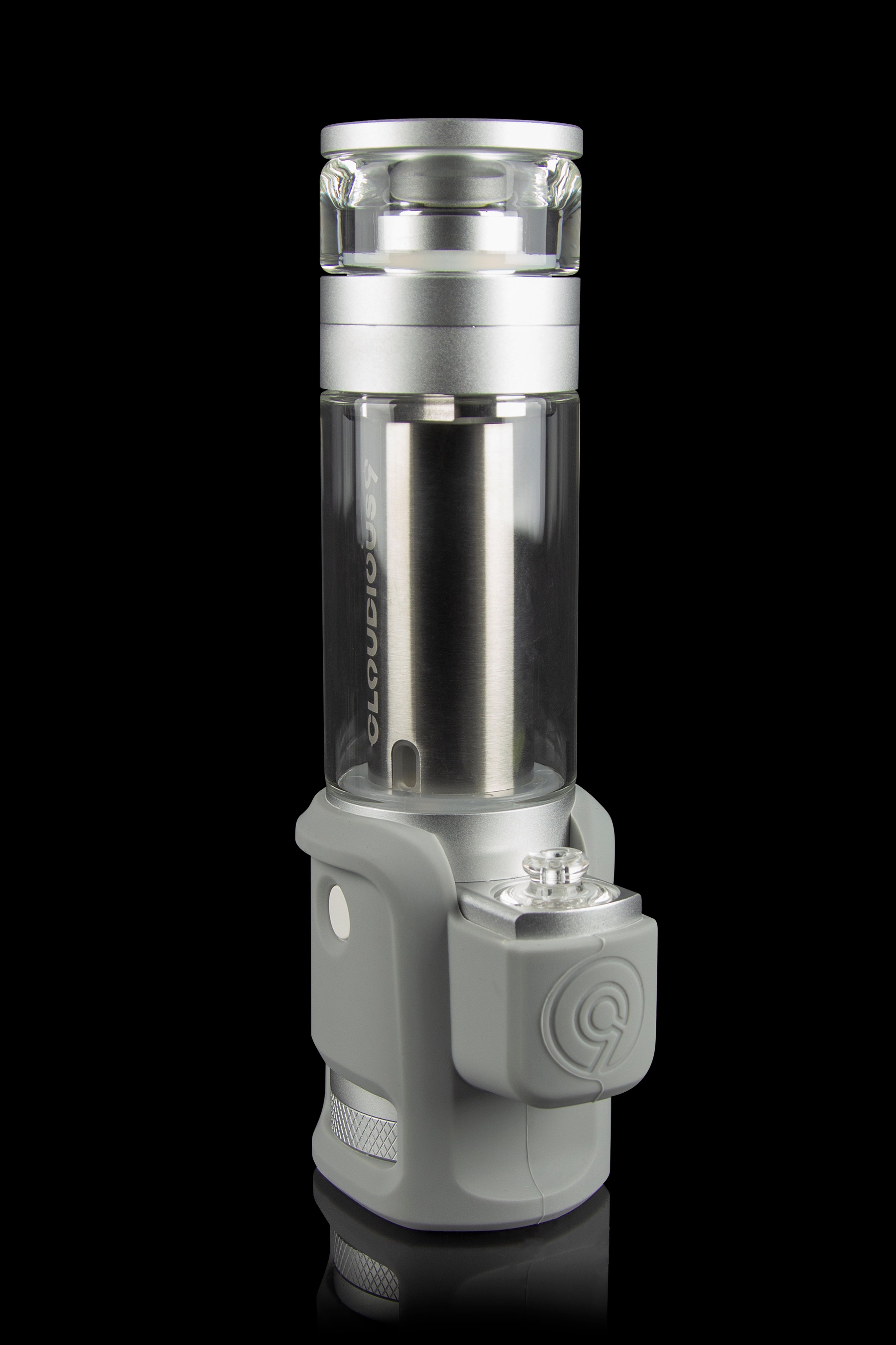Silver and gray cannabis oil vaporizer with glass chamber, displayed against a black background.