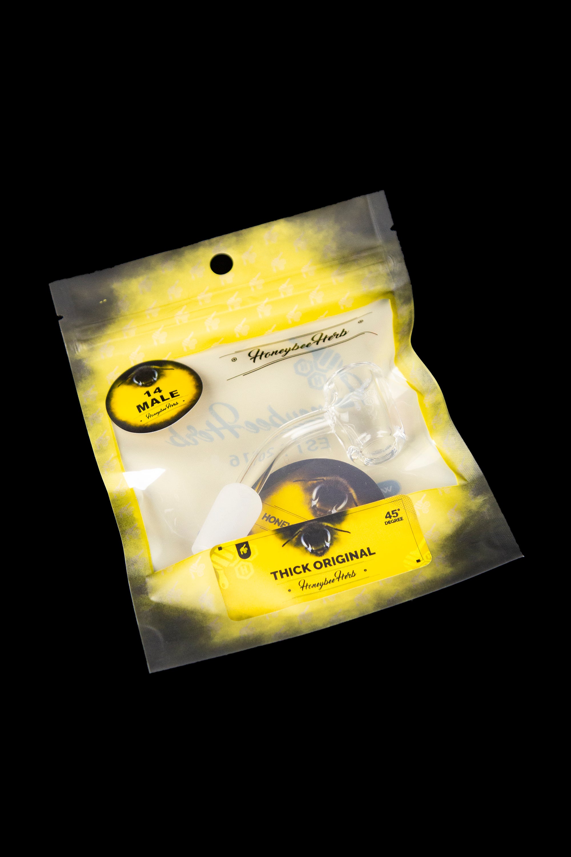 Yellow mylar bag of "Honeybee Herb" cannabis concentrate with a bee graphic.