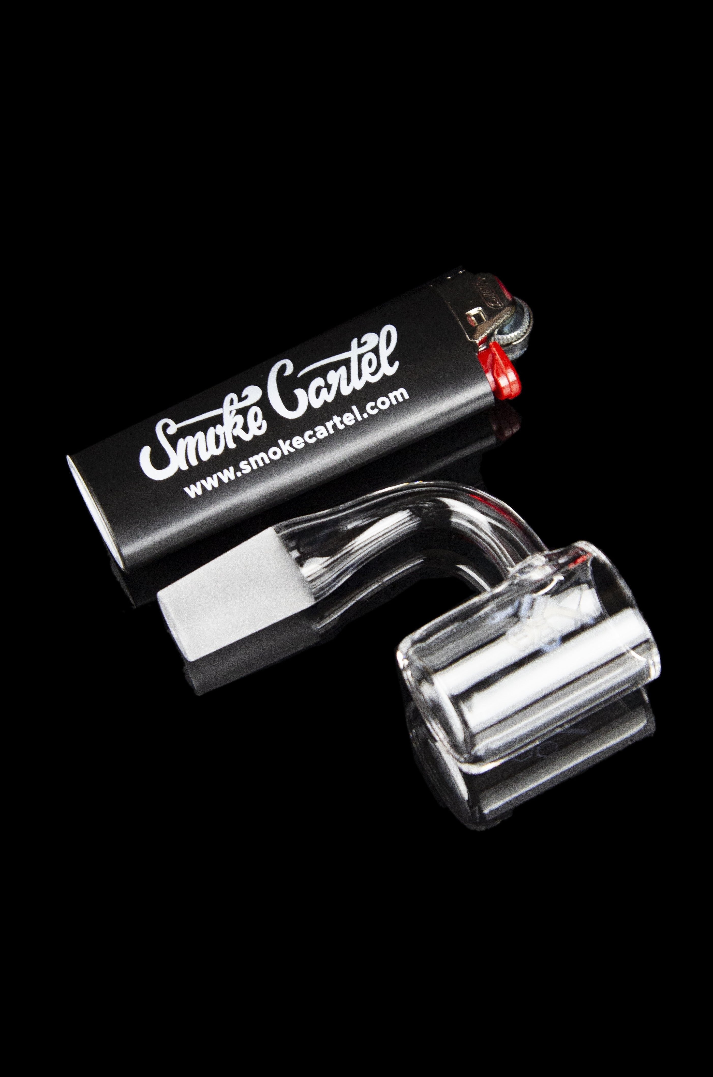 Clear glass dab rig with branded packaging.