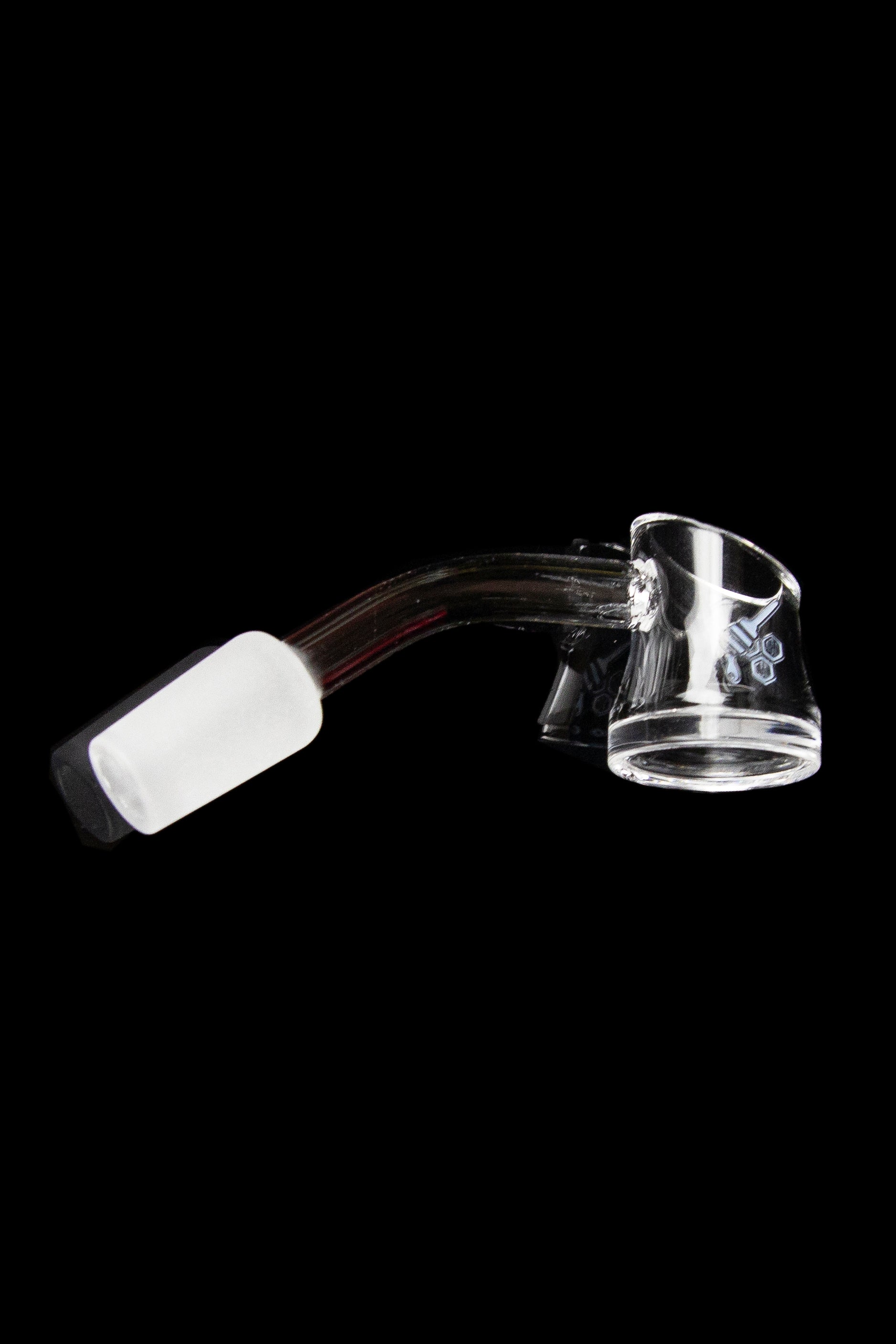 Clear quartz dab rig with a white carb cap, isolated on a black background.