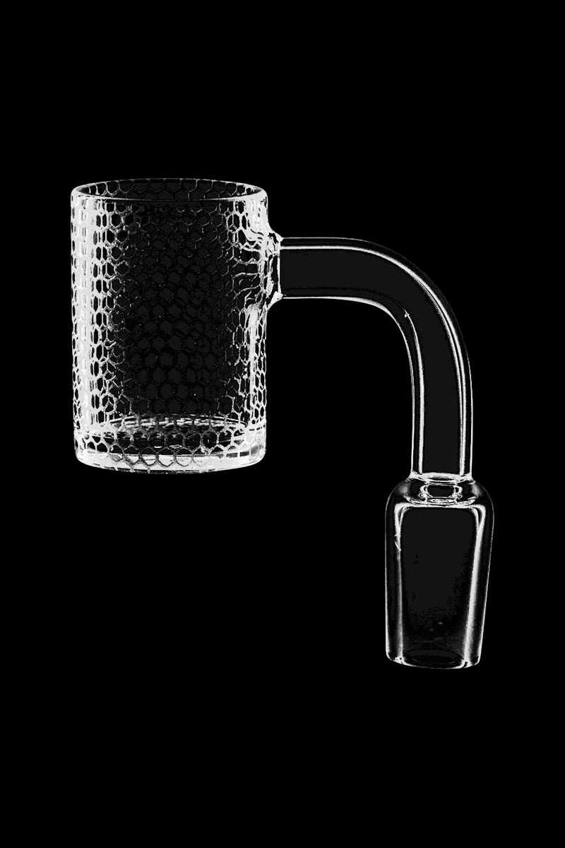 A close-up, angled view of the Infinite Honeycomb Etched Quartz Banger, showcasing its textured, clear glass construction.