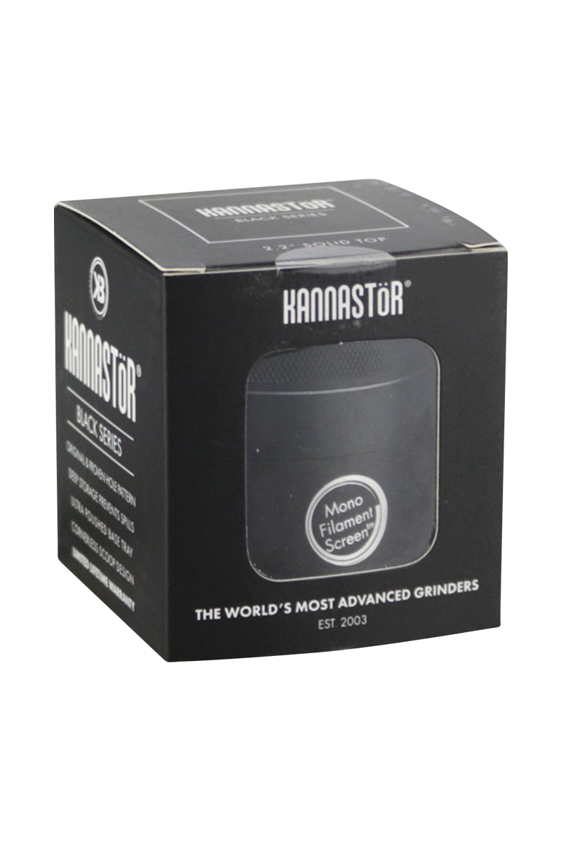 Close-up of the Kannastor Multi Chamber 4pc 2.2” Grinder against a black background, showcasing its multi-tiered design.