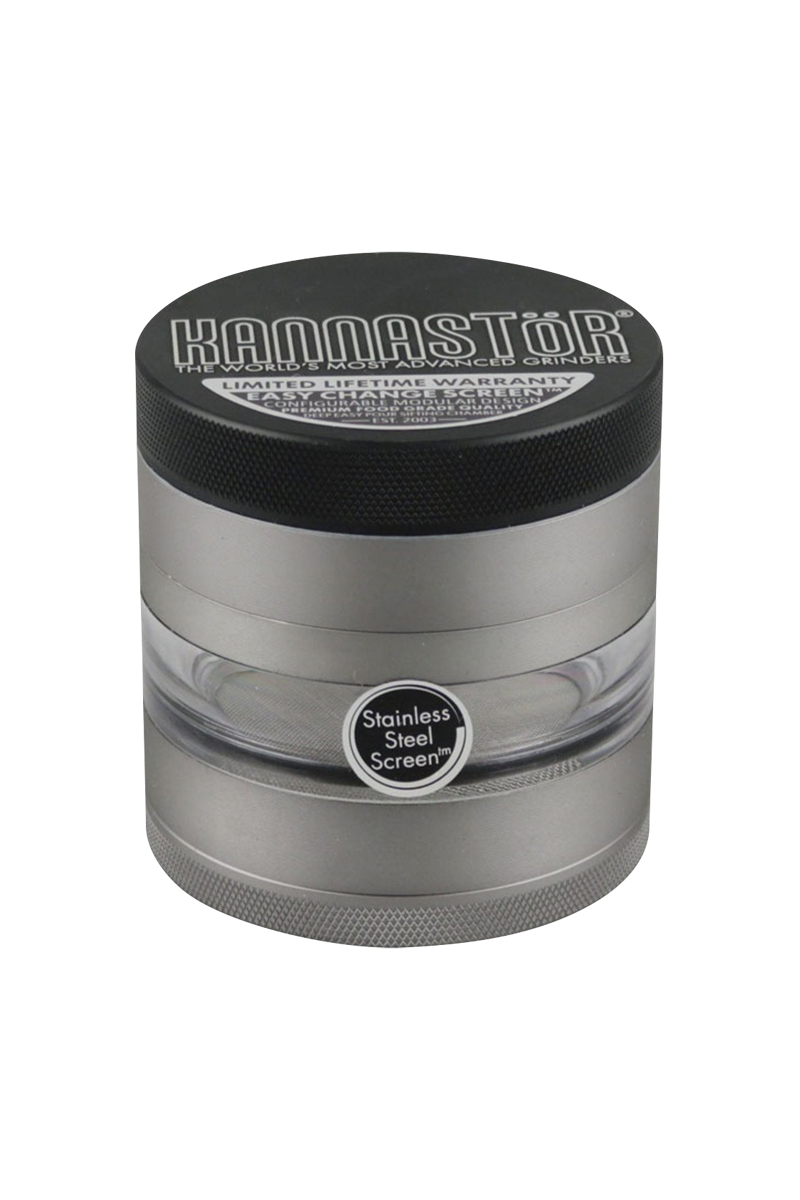 A close-up of the gunmetal Kannastor Multi Chamber Grinder, showcasing its multi-tiered design and circular shape.