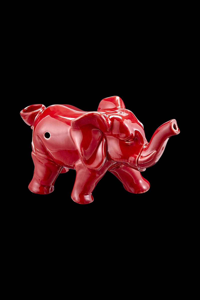 A side view of the Roast & Toast Lucky Elephant Ceramic Pipe, showcasing its detailed sculpting and glossy finish.